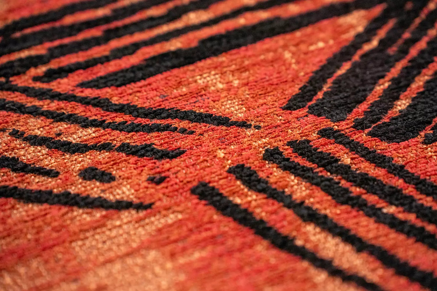 Orange oval rug KANJI with black