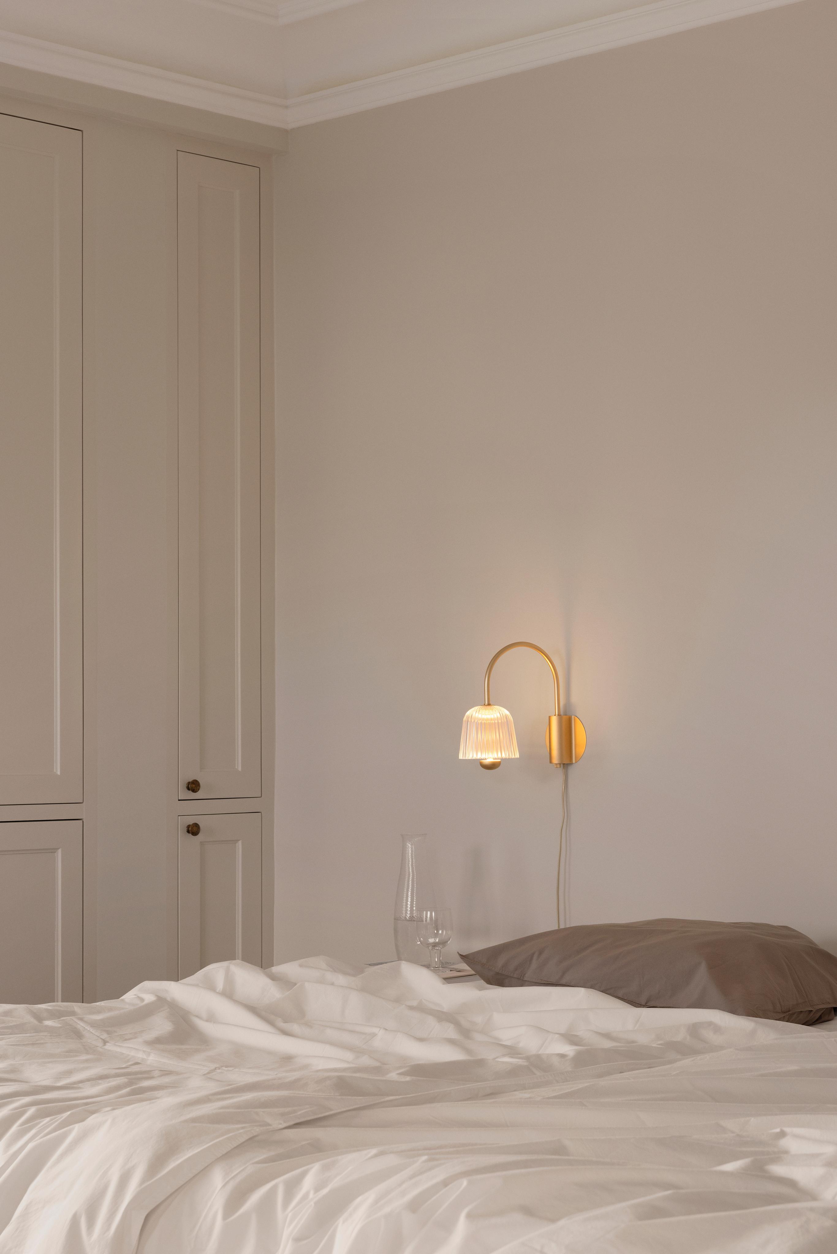 Wandleuchte ASTEEA gold mit transparentem Design
