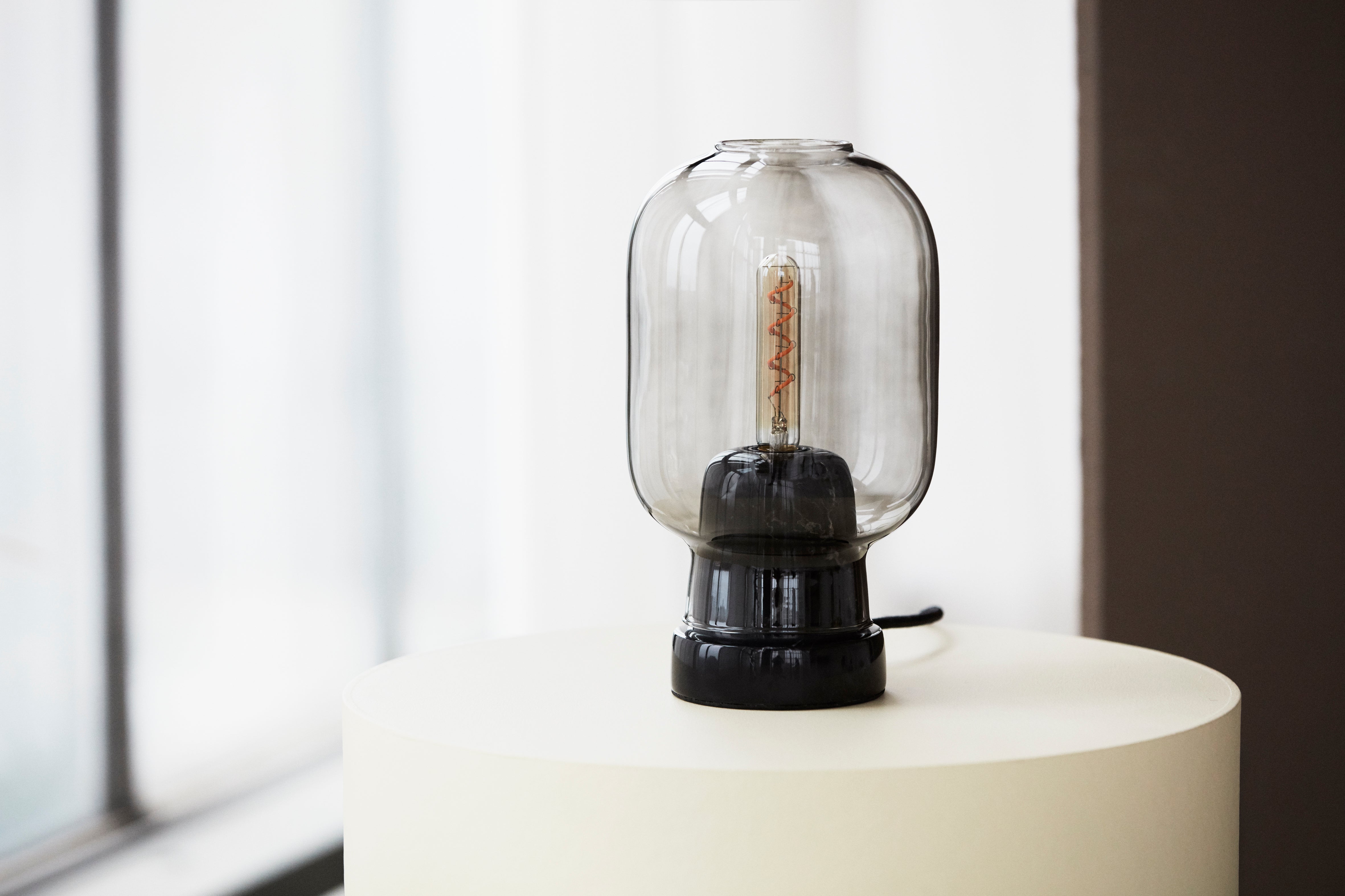 AMP table lamp in smoked glass with black marble