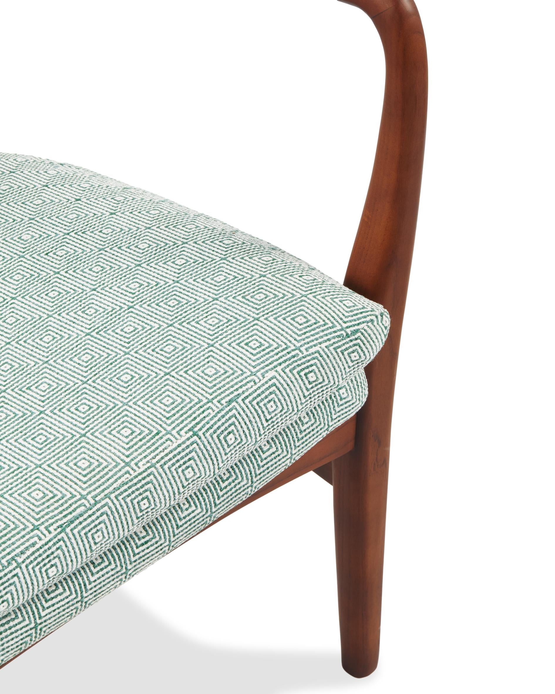 PEGGY armchair in green with geometric patterns and a wooden base