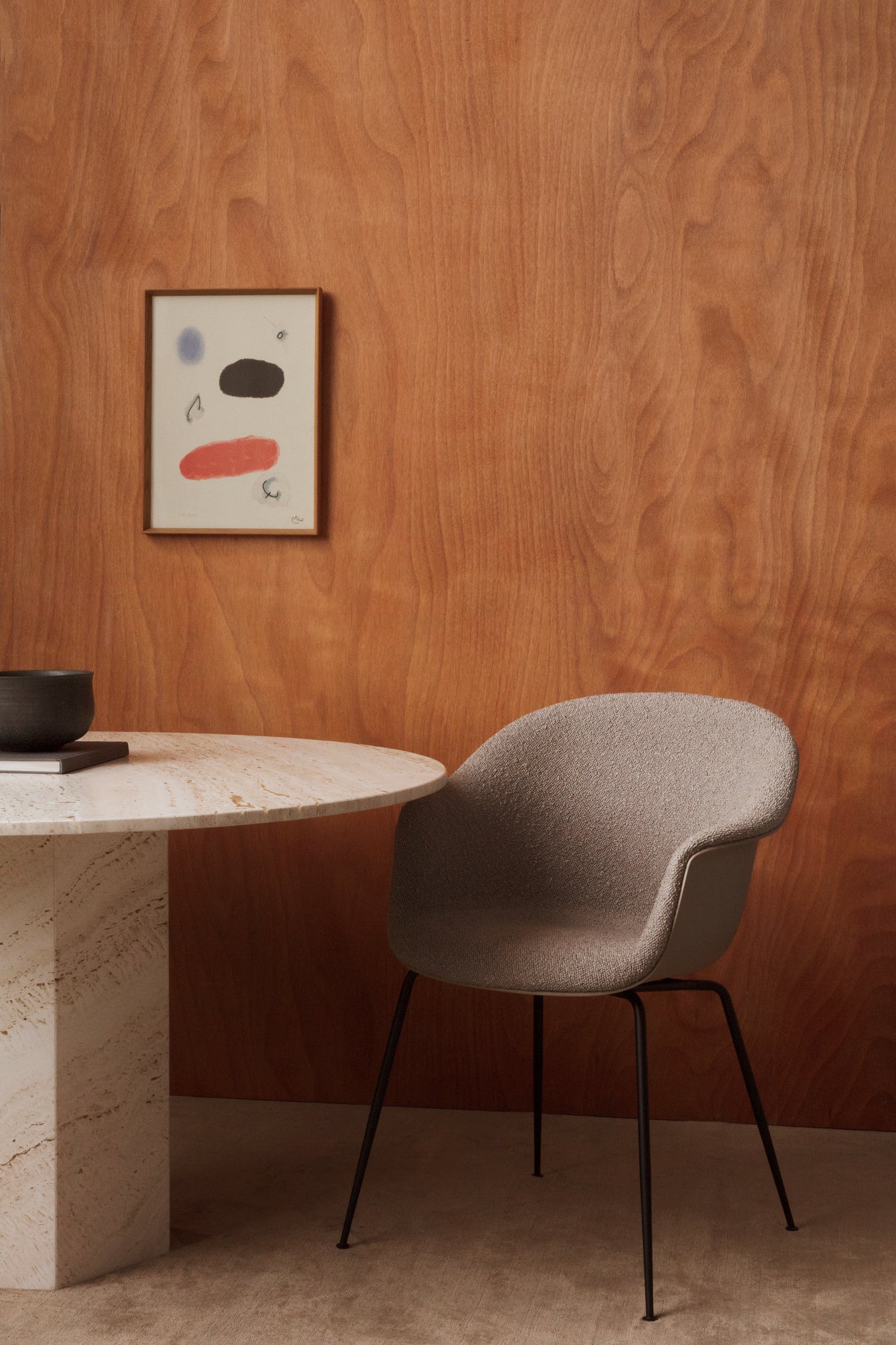 BAT upholstered chair with black chrome base