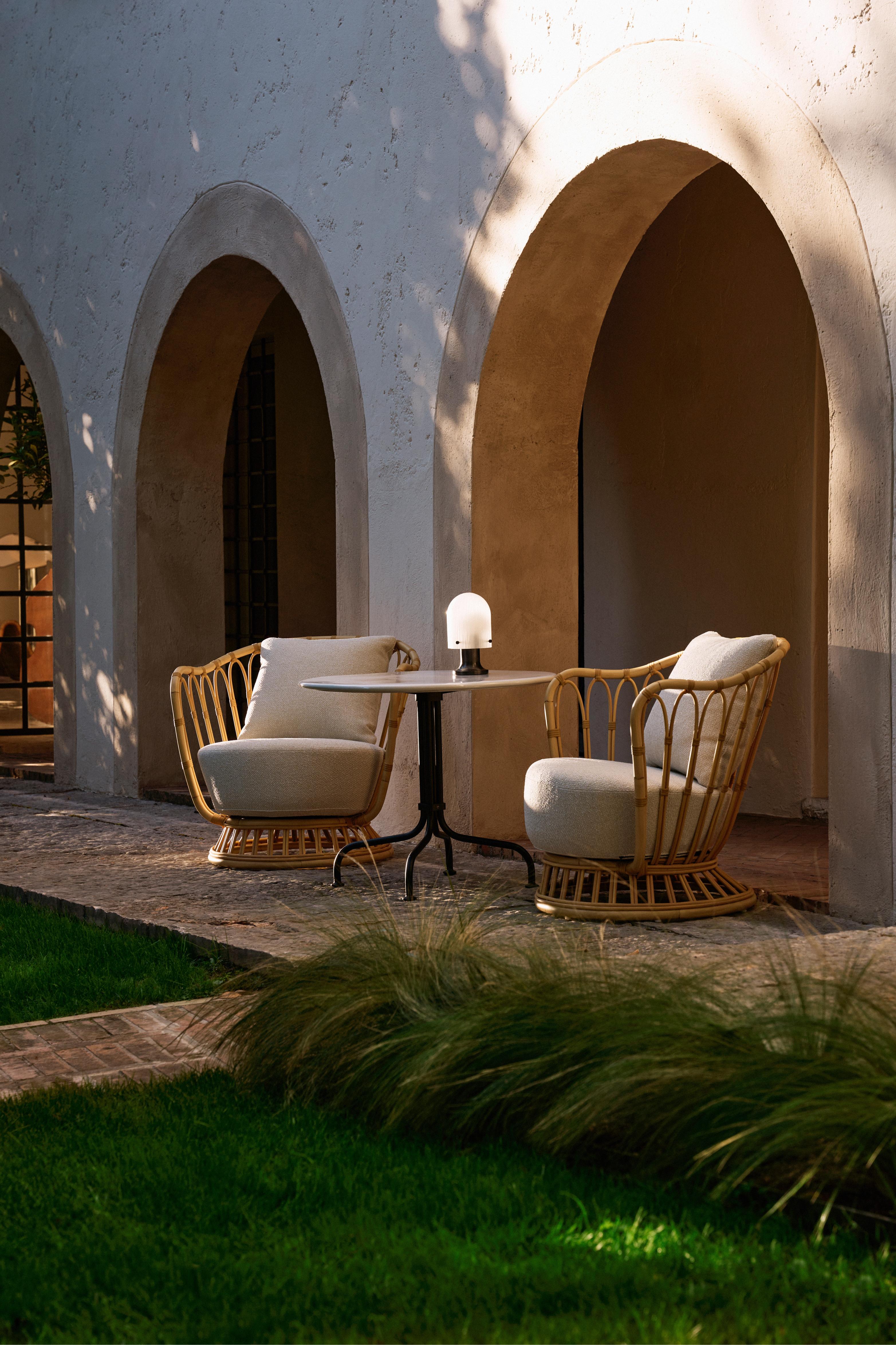 GRACE upholstered garden armchair with a rattan base