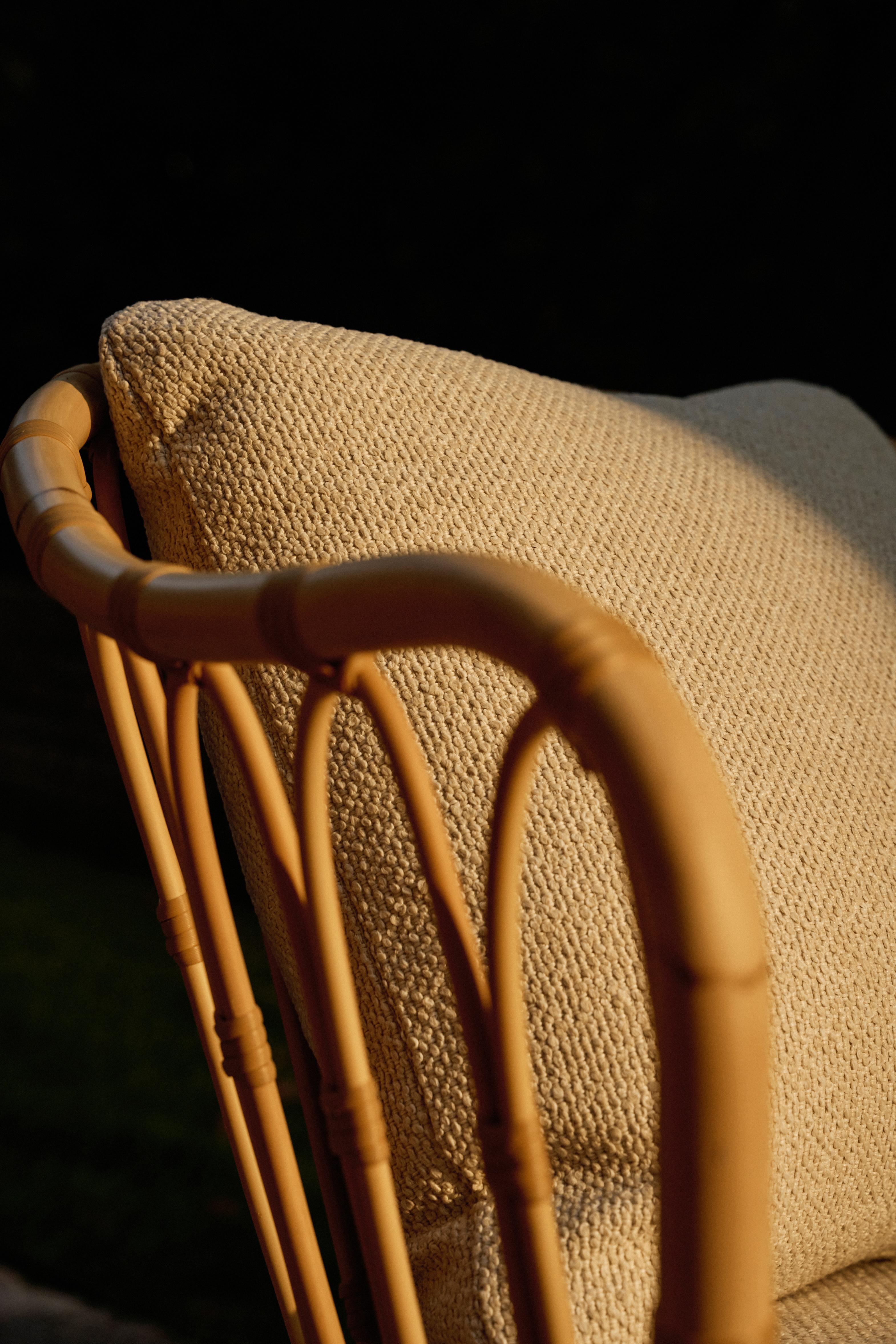 GRACE upholstered garden armchair with a rattan base