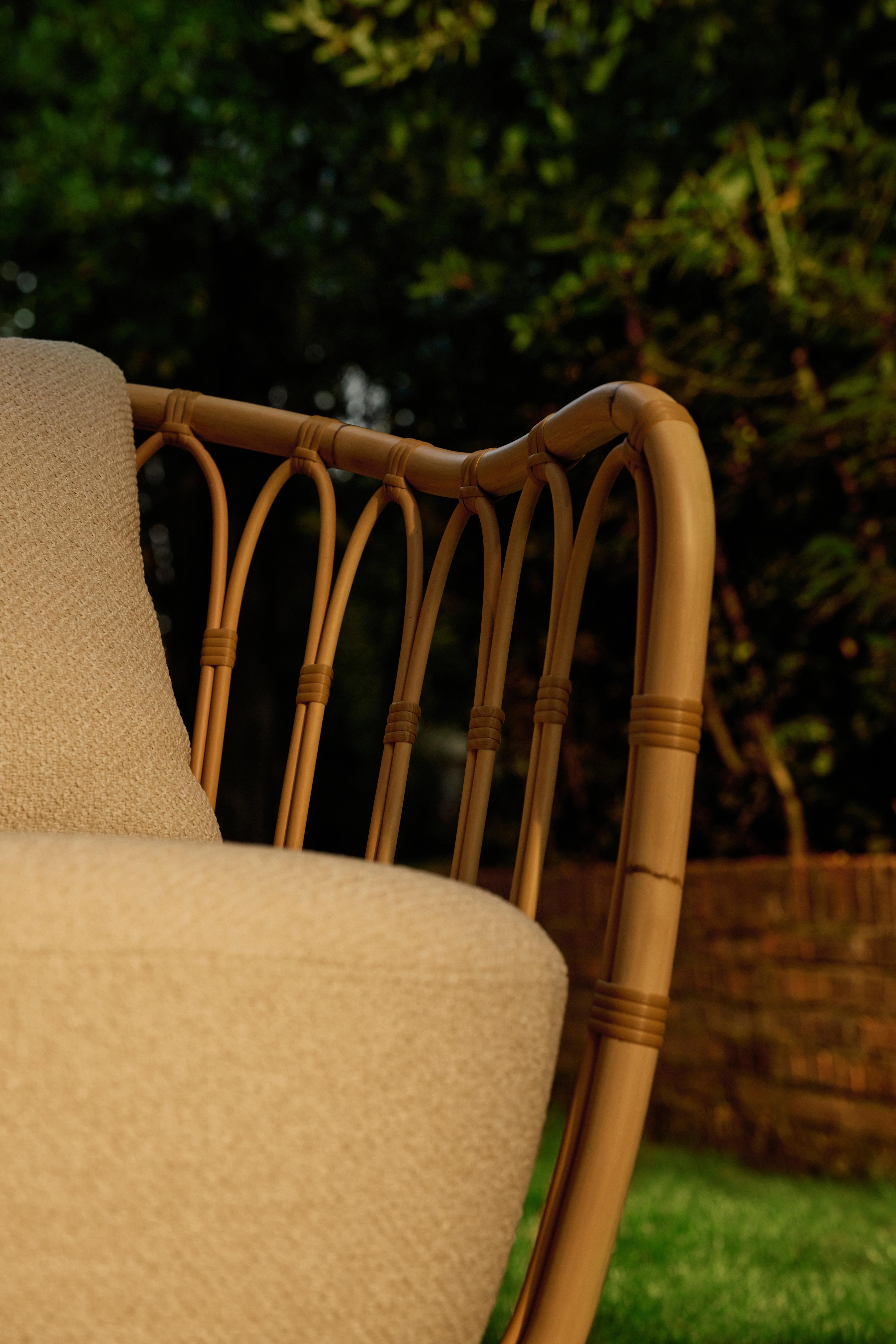 GRACE upholstered garden armchair with a rattan base