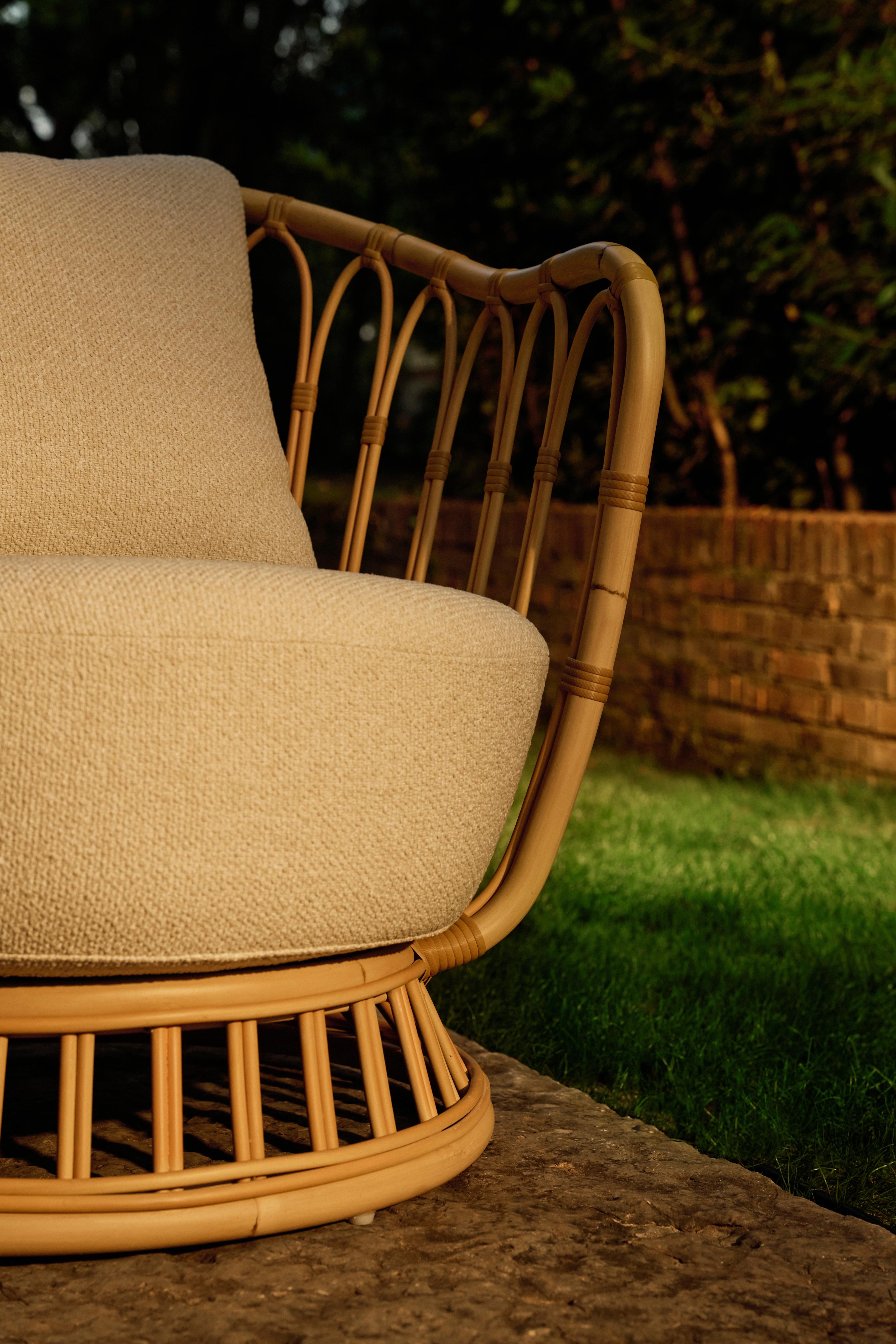 GRACE upholstered garden armchair with a rattan base