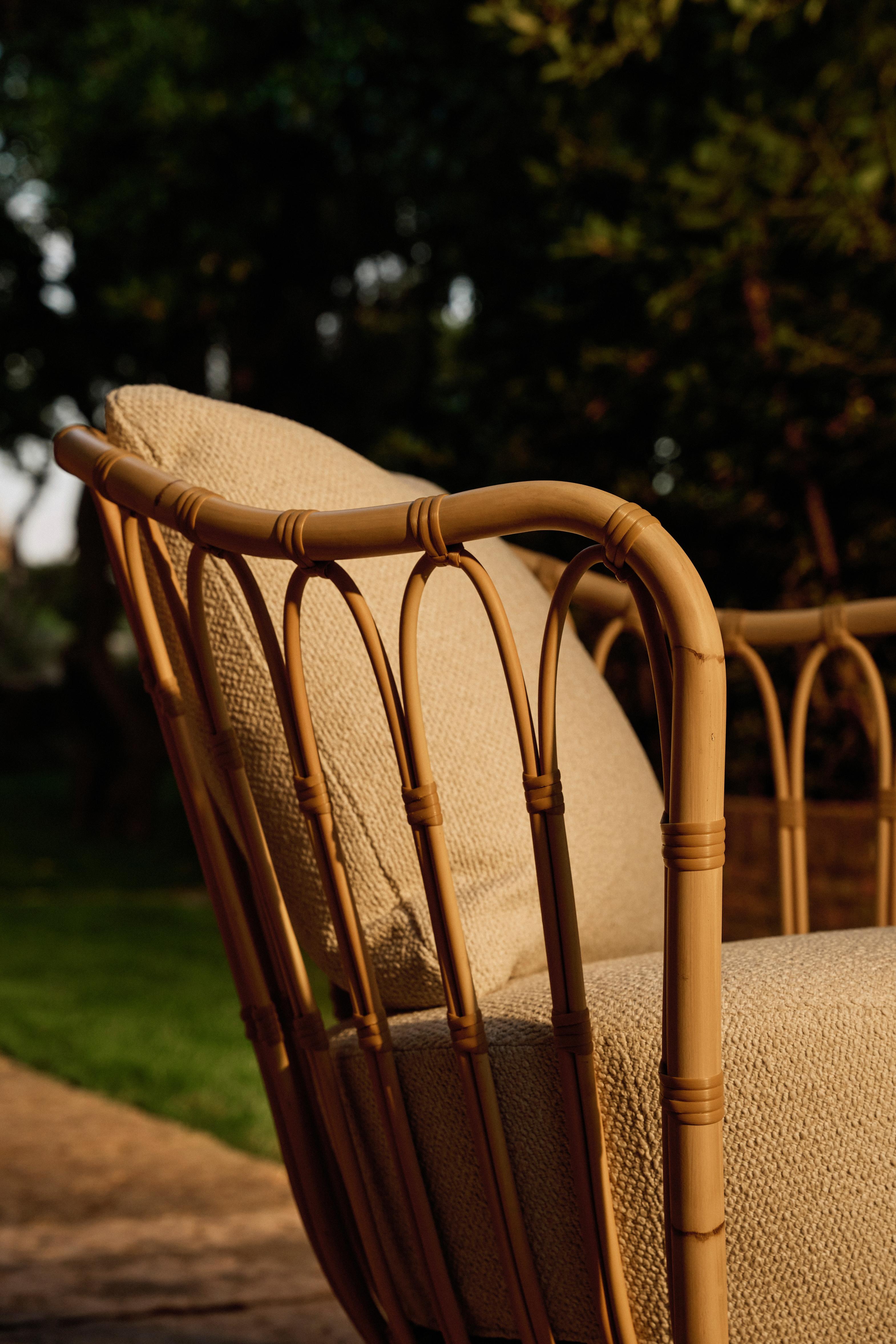 GRACE upholstered garden armchair with a rattan base