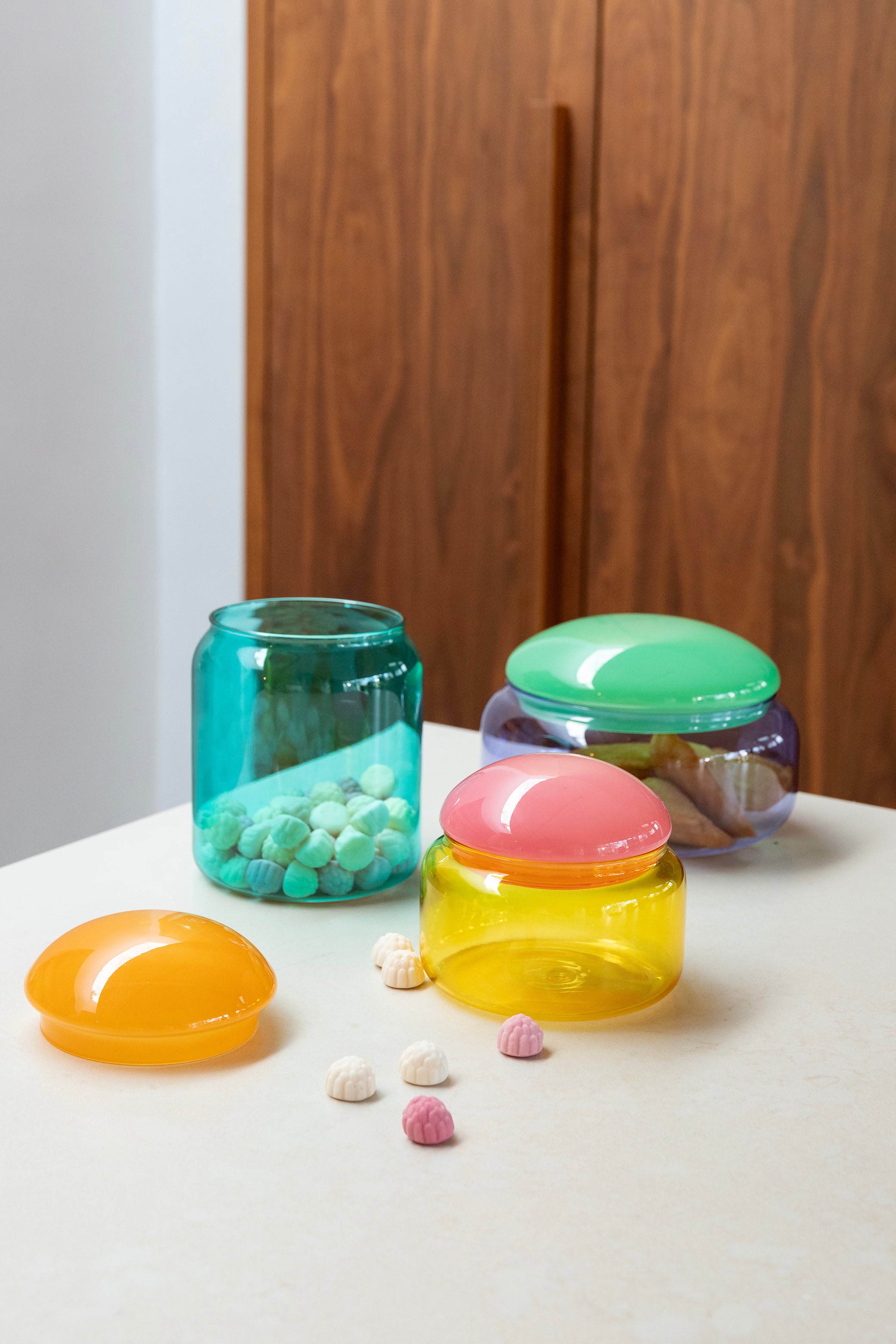 Turquoise glass container PUFFY with an orange lid