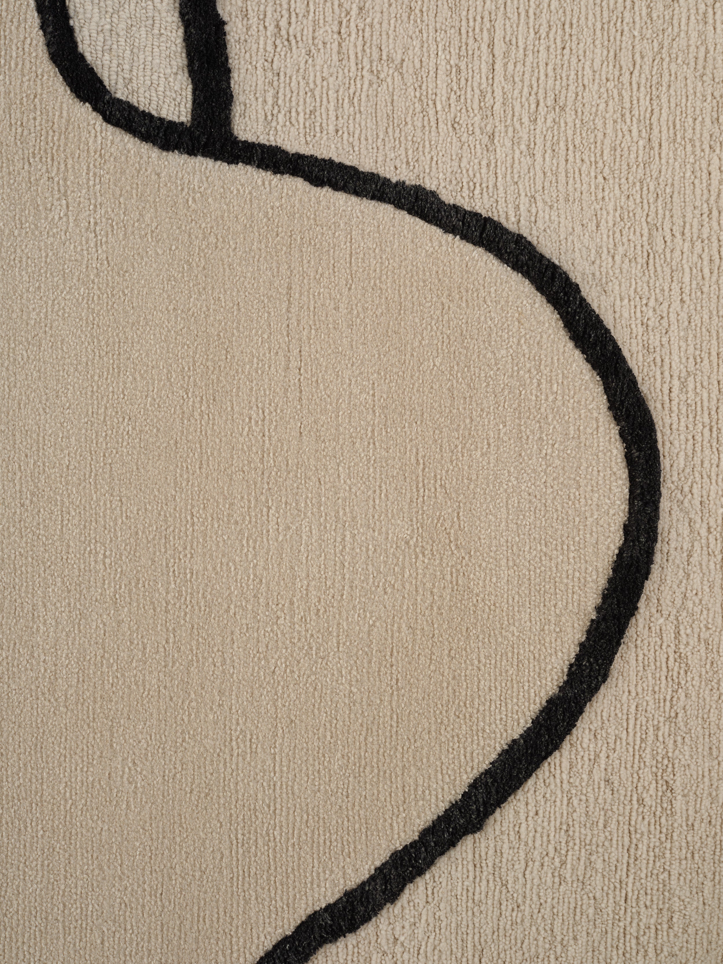 SELF MIRAGE beige rug with black