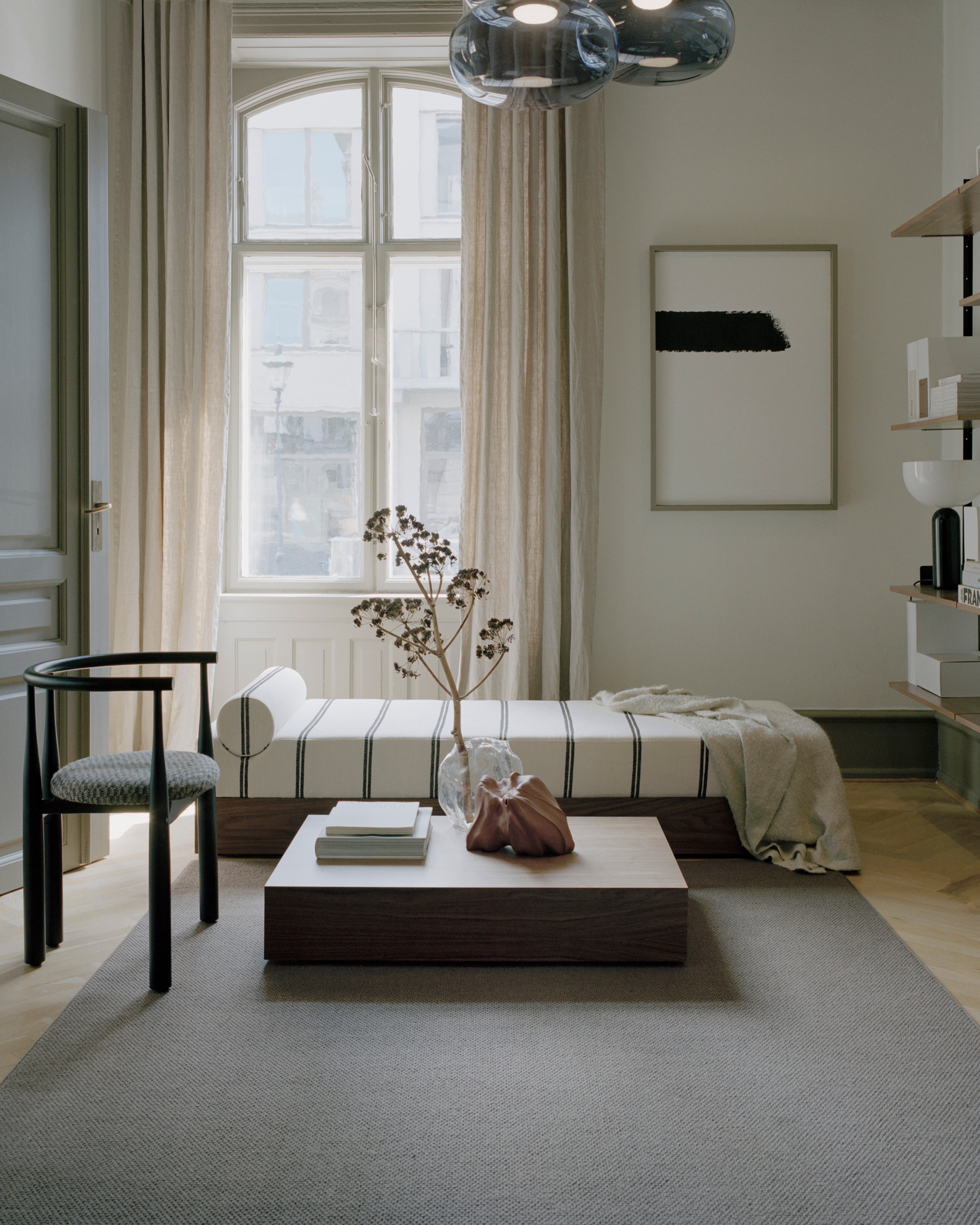 Mass upholstered couch with a wooden base
