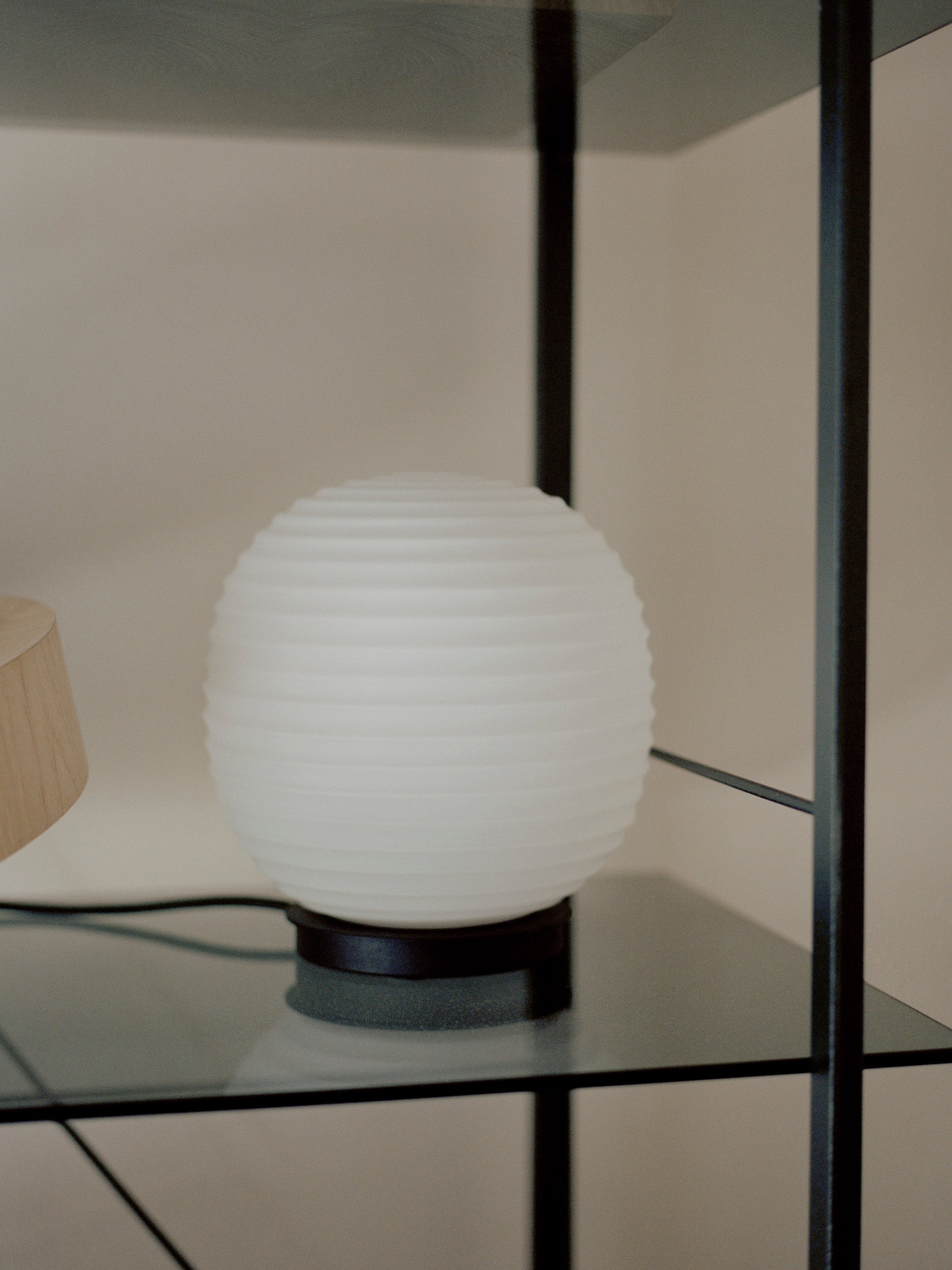 Lantern Globe white table lamp with a black base