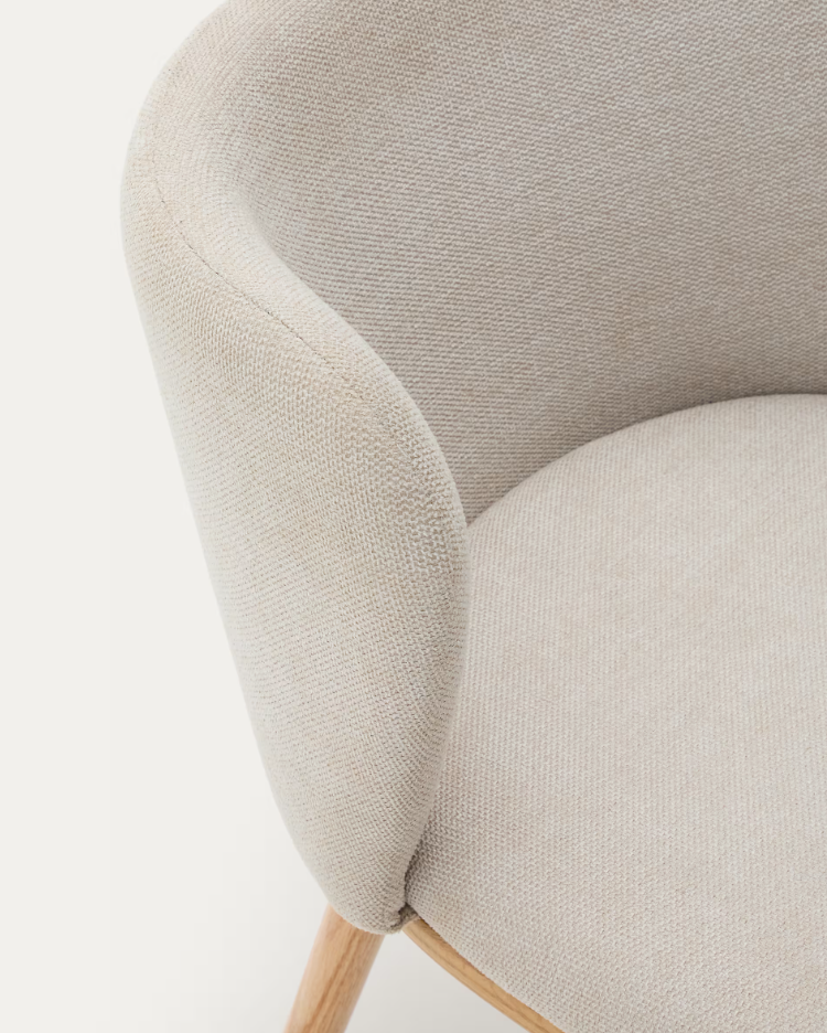 A chair in the ciselia beige szenil fabric with a bright base