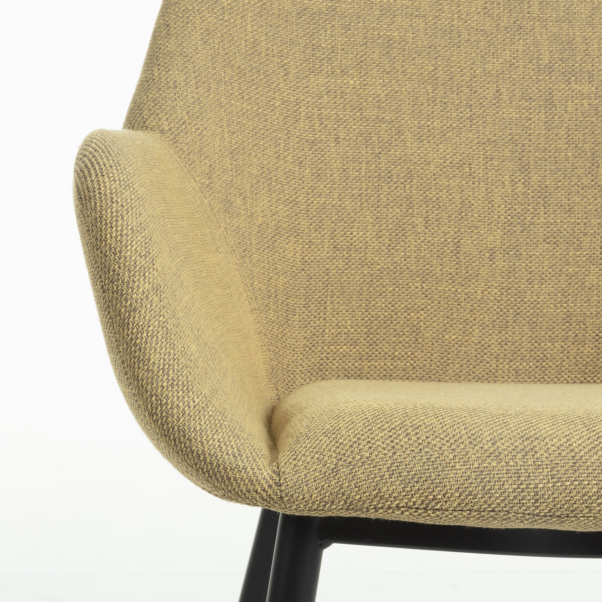 A chair in a black mustard horse fabric with a black base