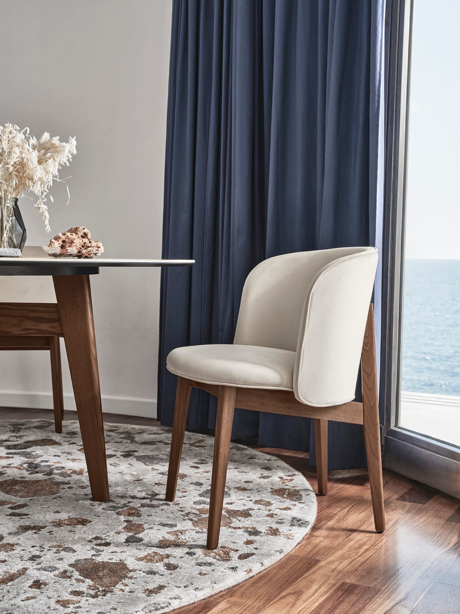 Armchair ABREY upholstered with a black wooden base