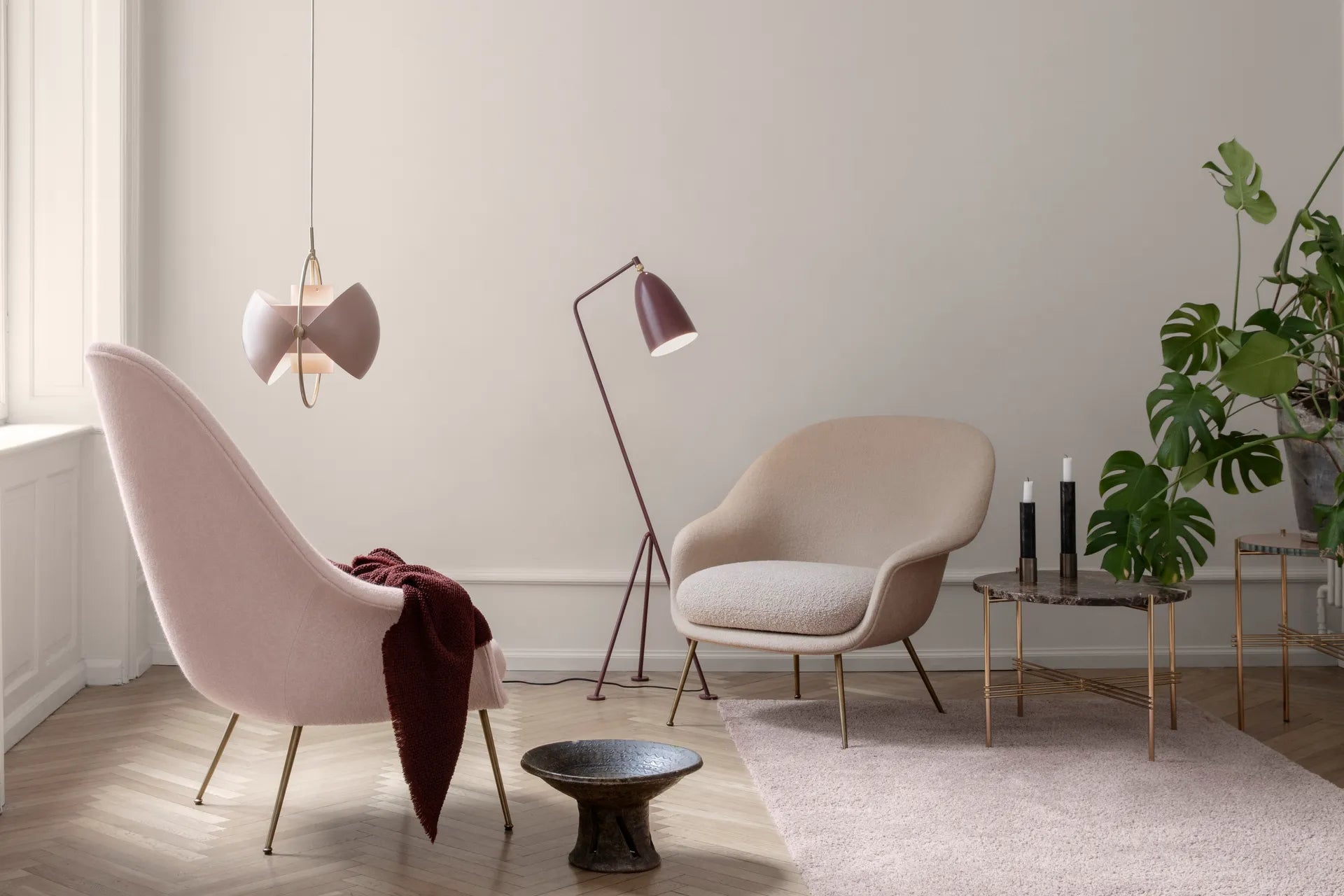Upholstered BAT armchair with black base
