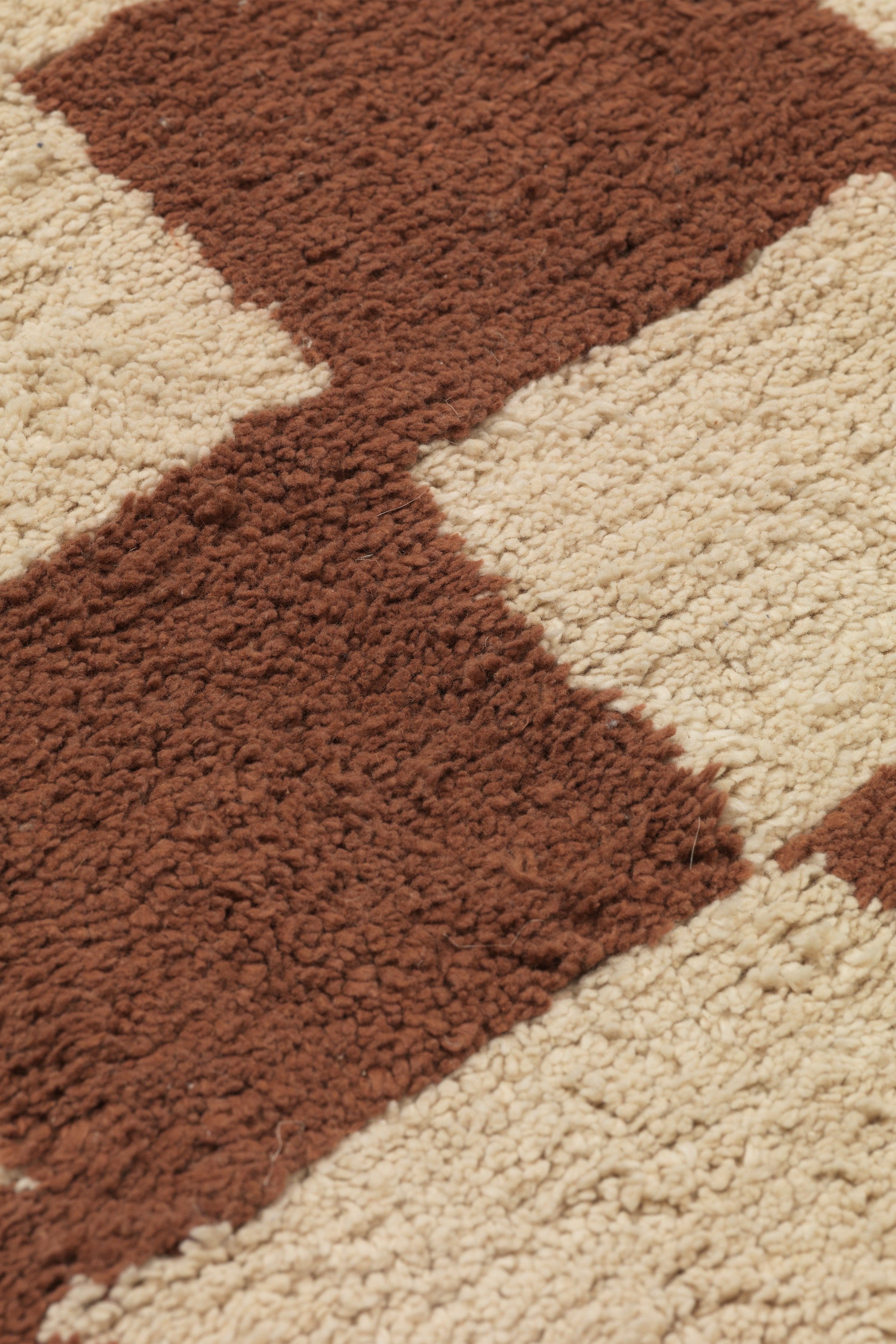 MARA rug in rust with sand