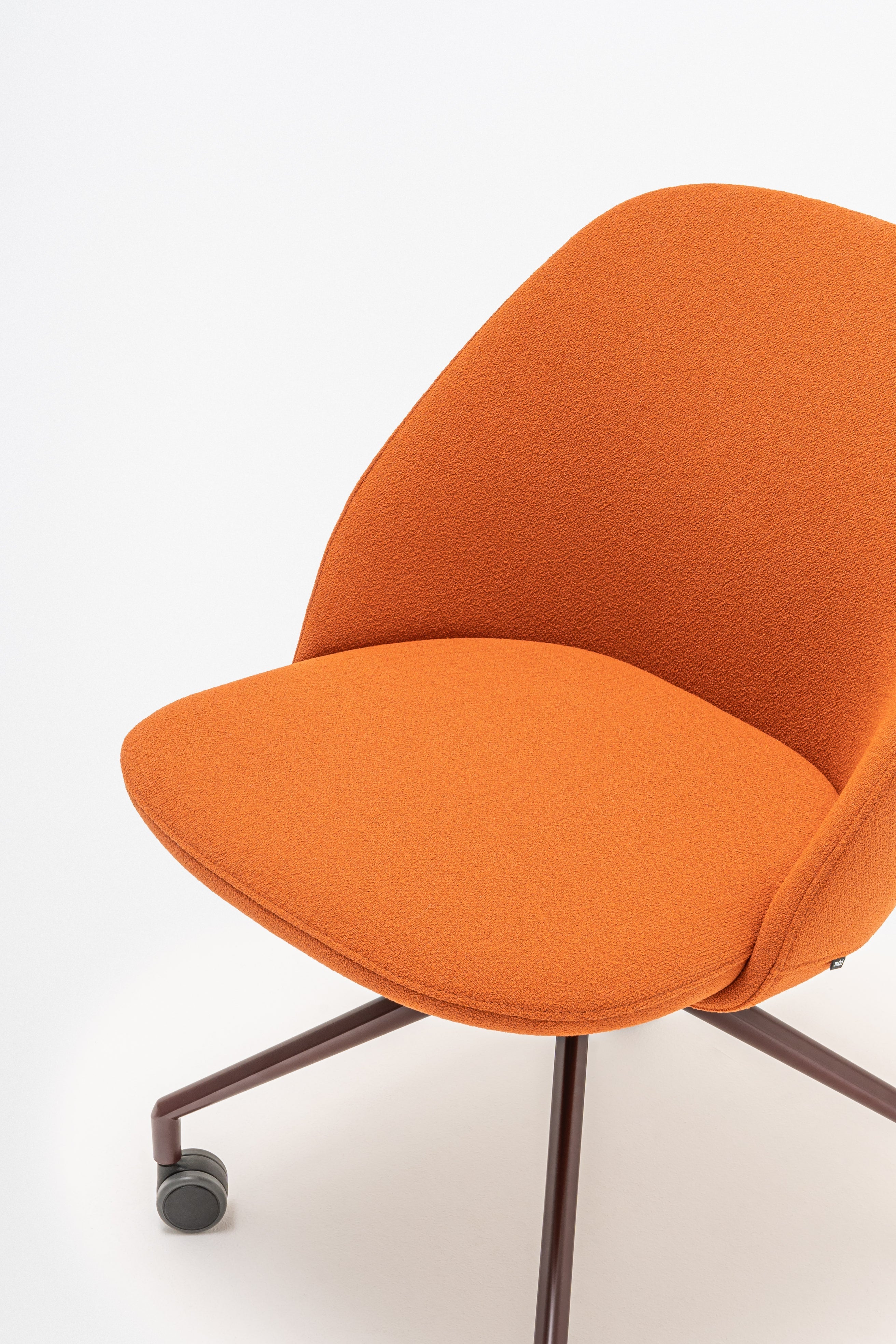 Swivel armchair with low back, a metal parallel base with wheels to a hard surface