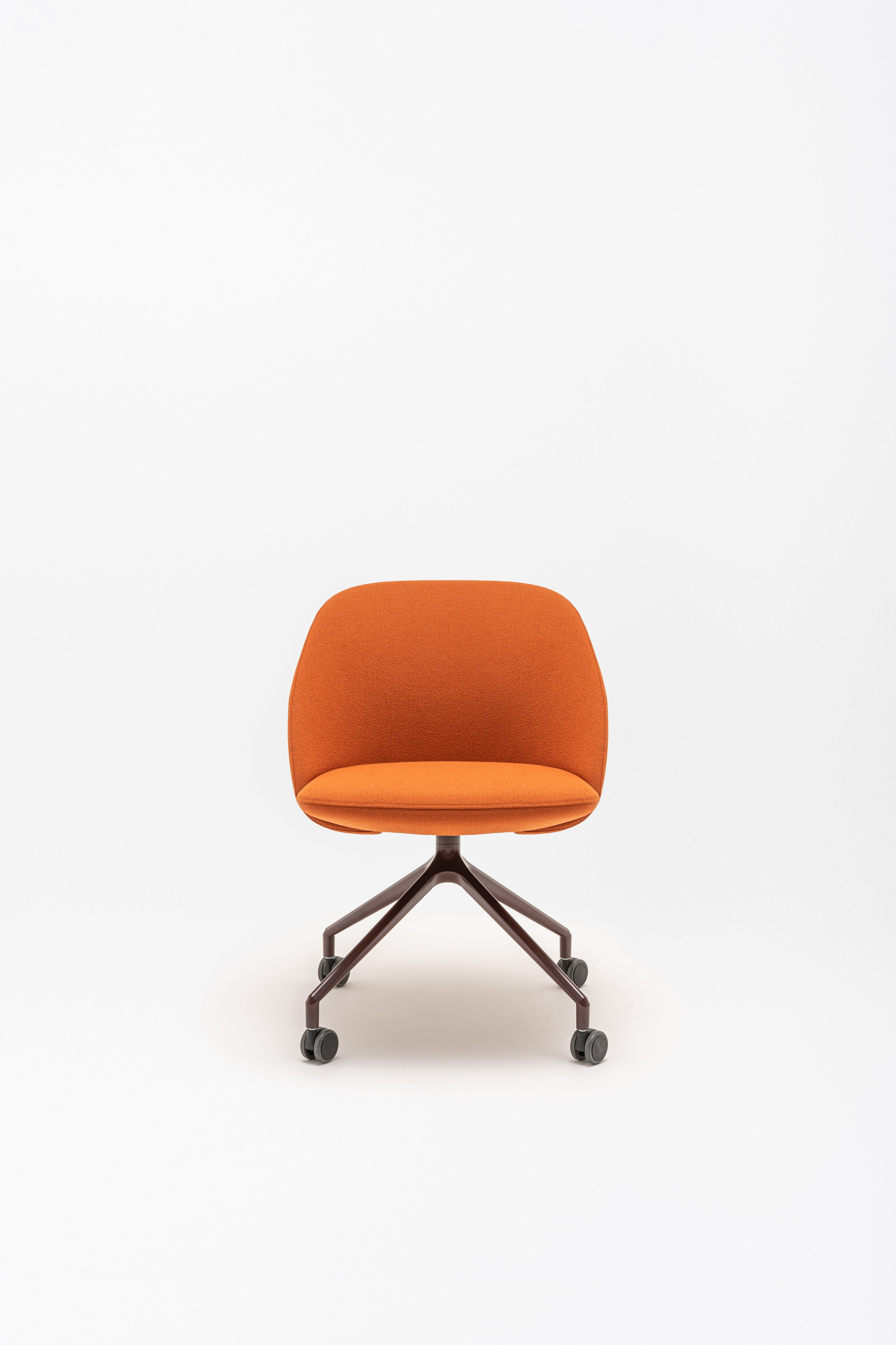 Swivel armchair with low back, a metal parallel base with wheels to a hard surface