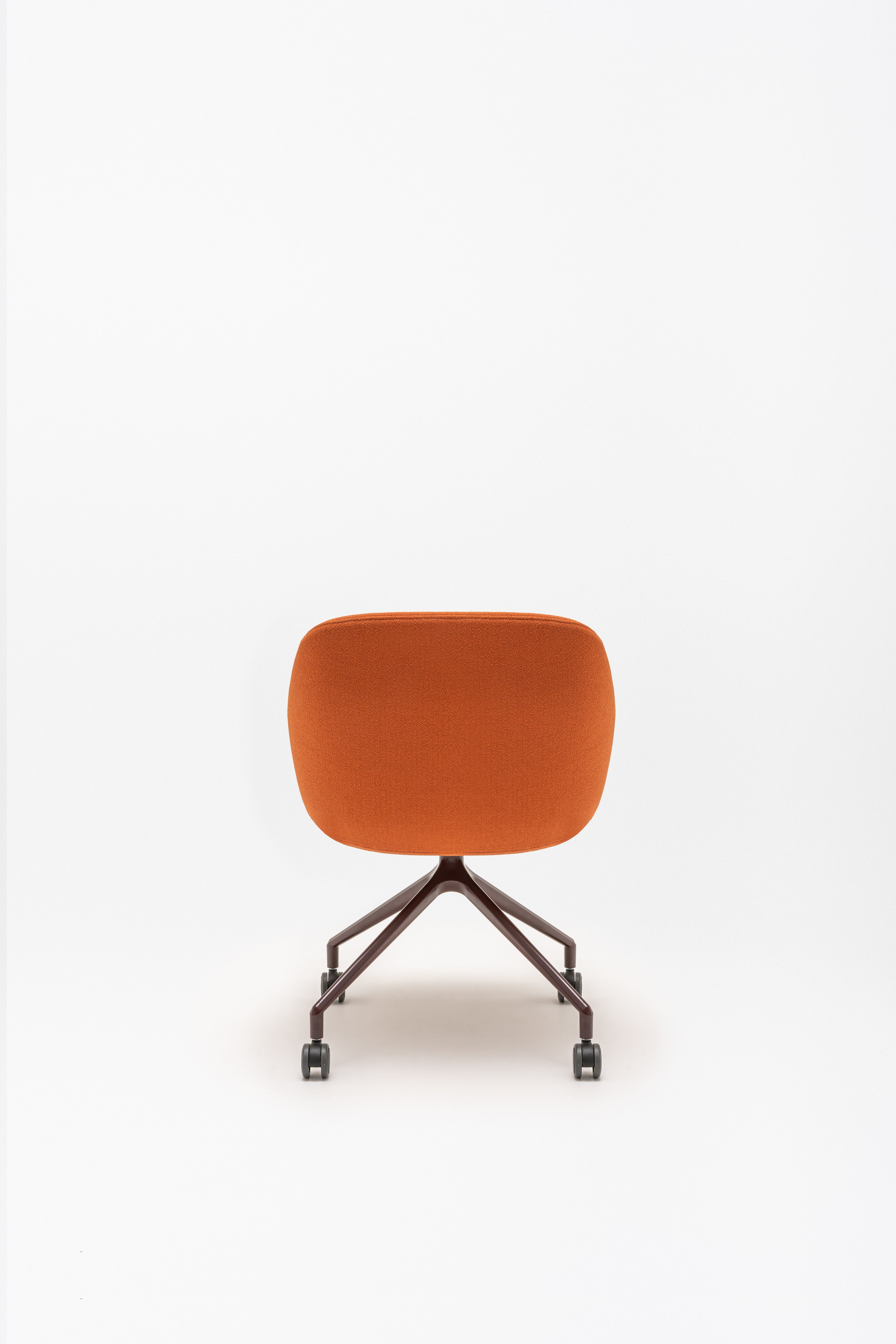 Swivel armchair with low back, a metal parallel base with wheels to a hard surface