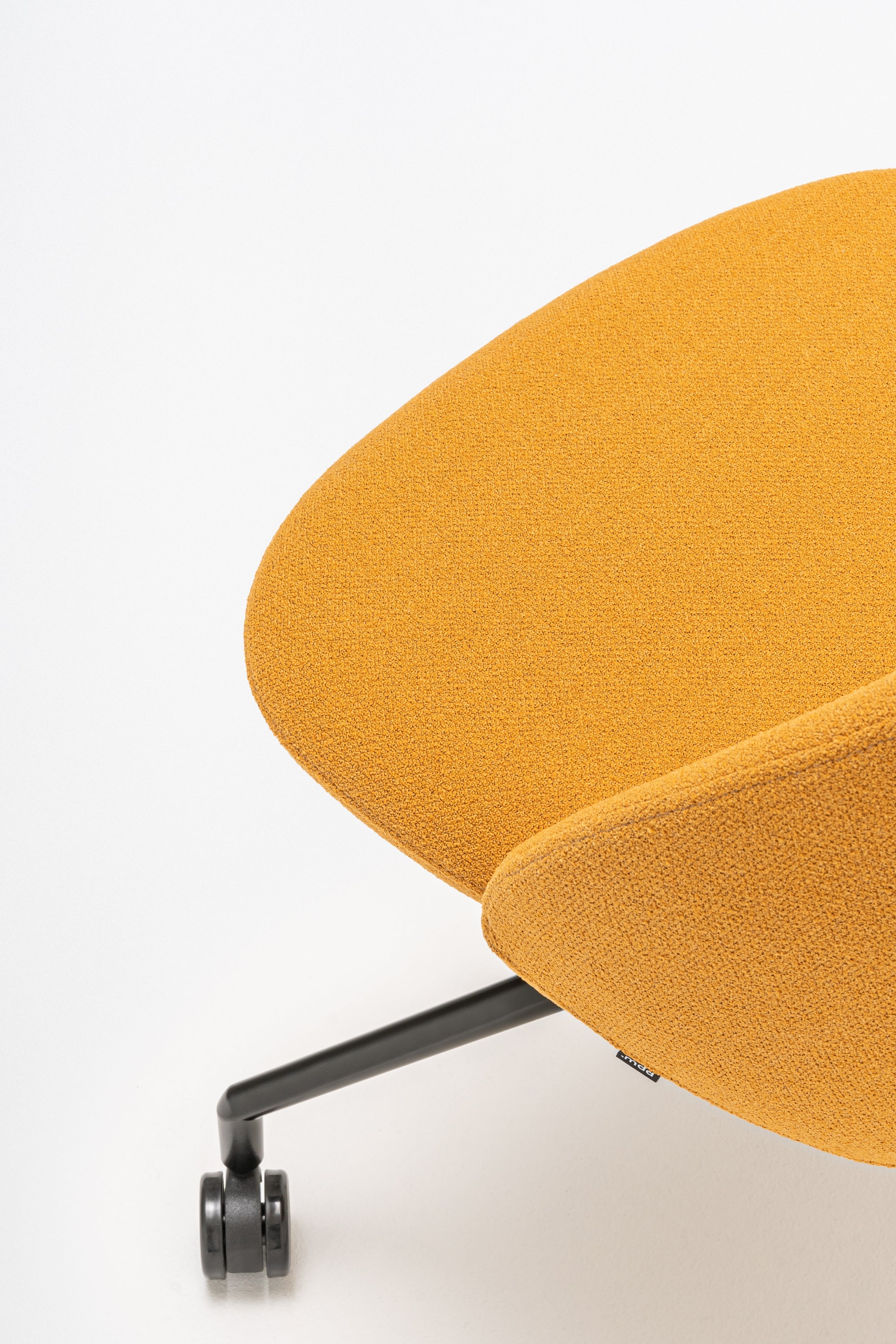 Rotable armchair with a high back, a metal parallel base with wheels to a soft surface