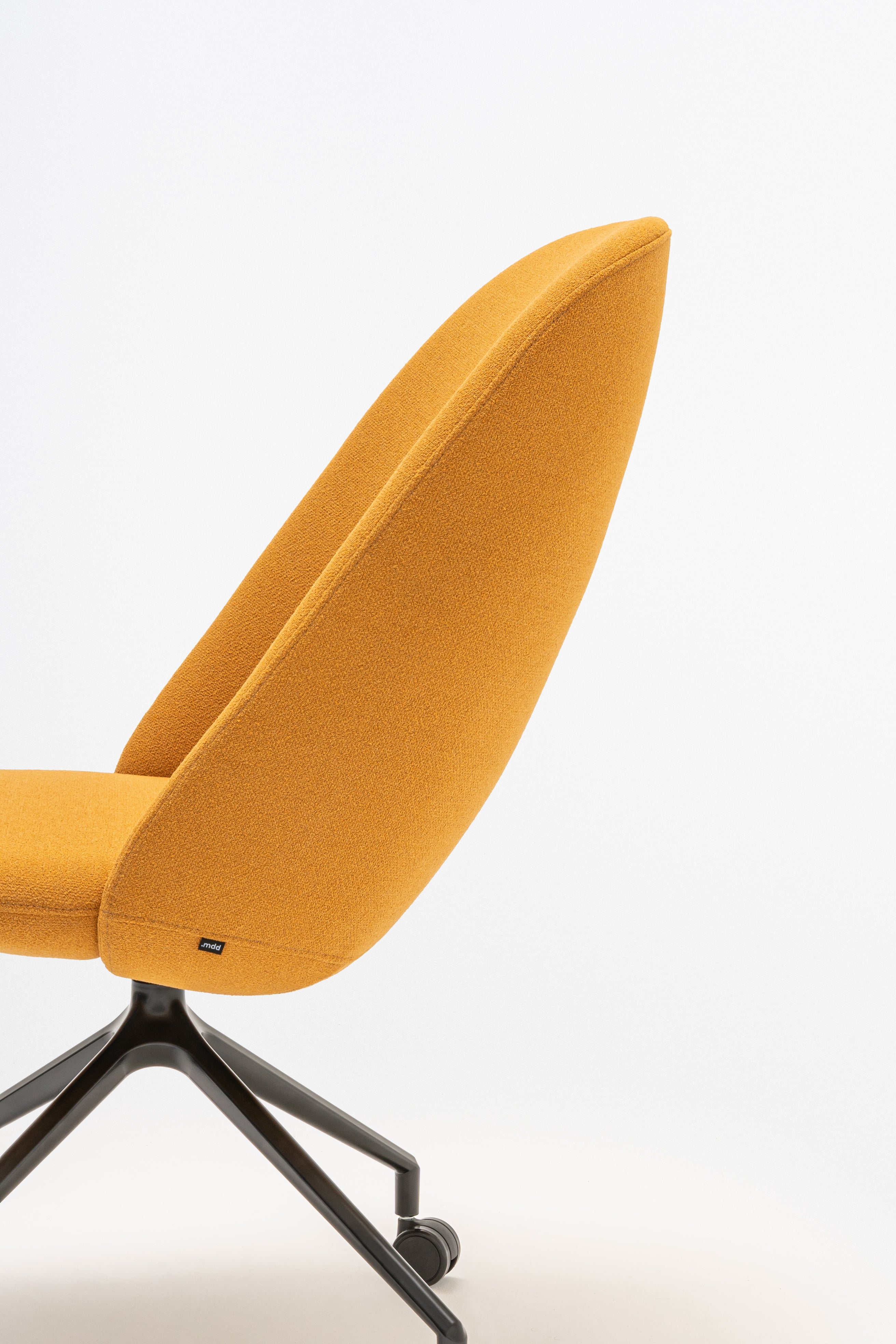 Rotable armchair with a high back, a metal parallel base with wheels to a soft surface