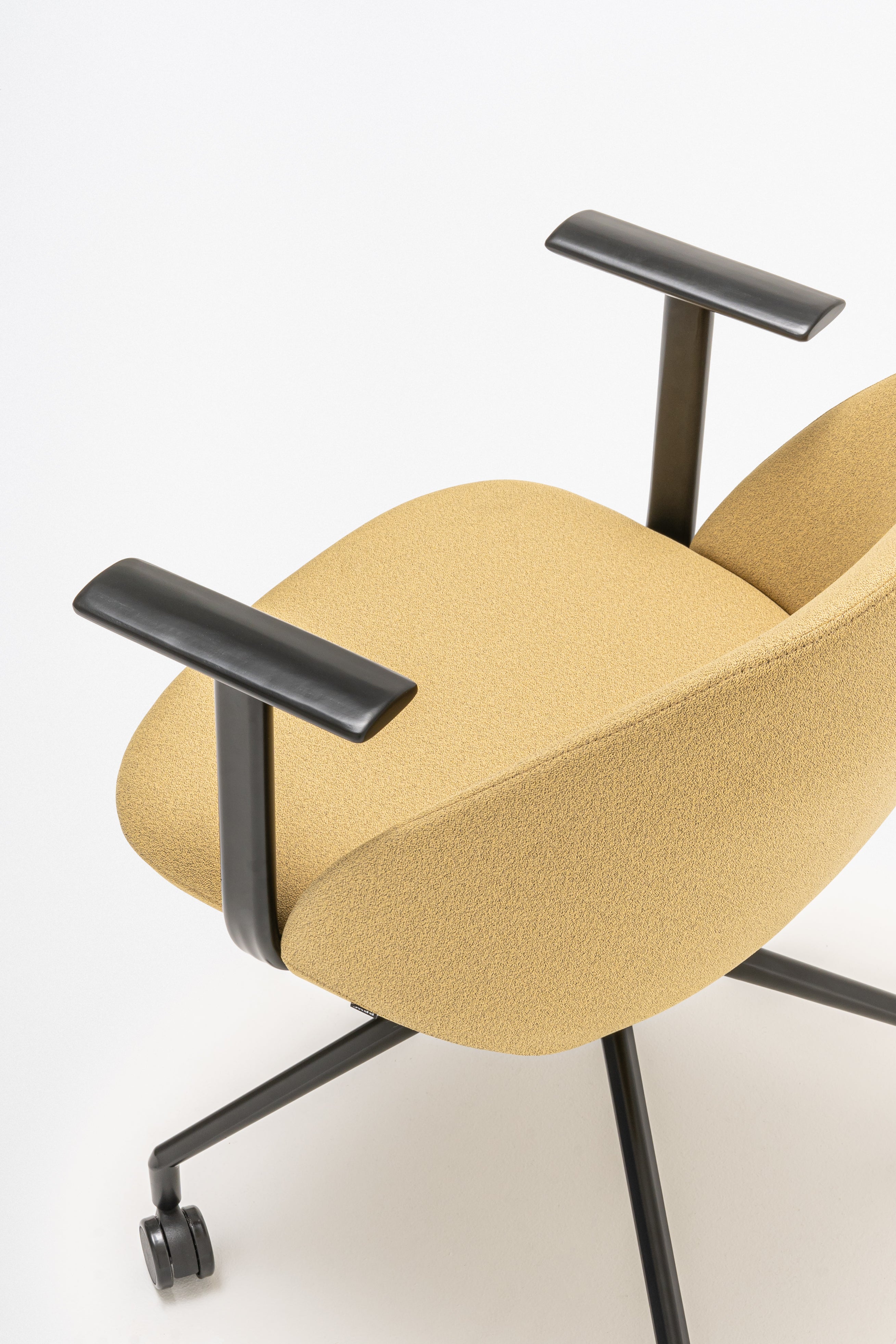 Swivel armchair with low back, a metal parallel base with wheels to a hard surface
