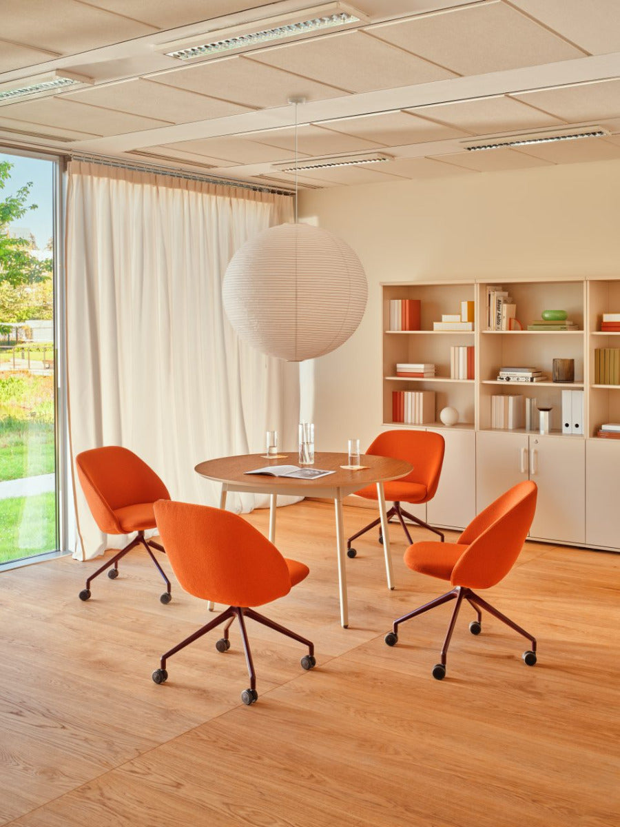 Swivel armchair with low back, a metal parallel base with wheels to a hard surface