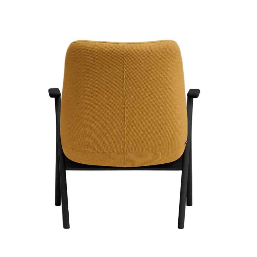DINS mustard armchair with a black wooden base