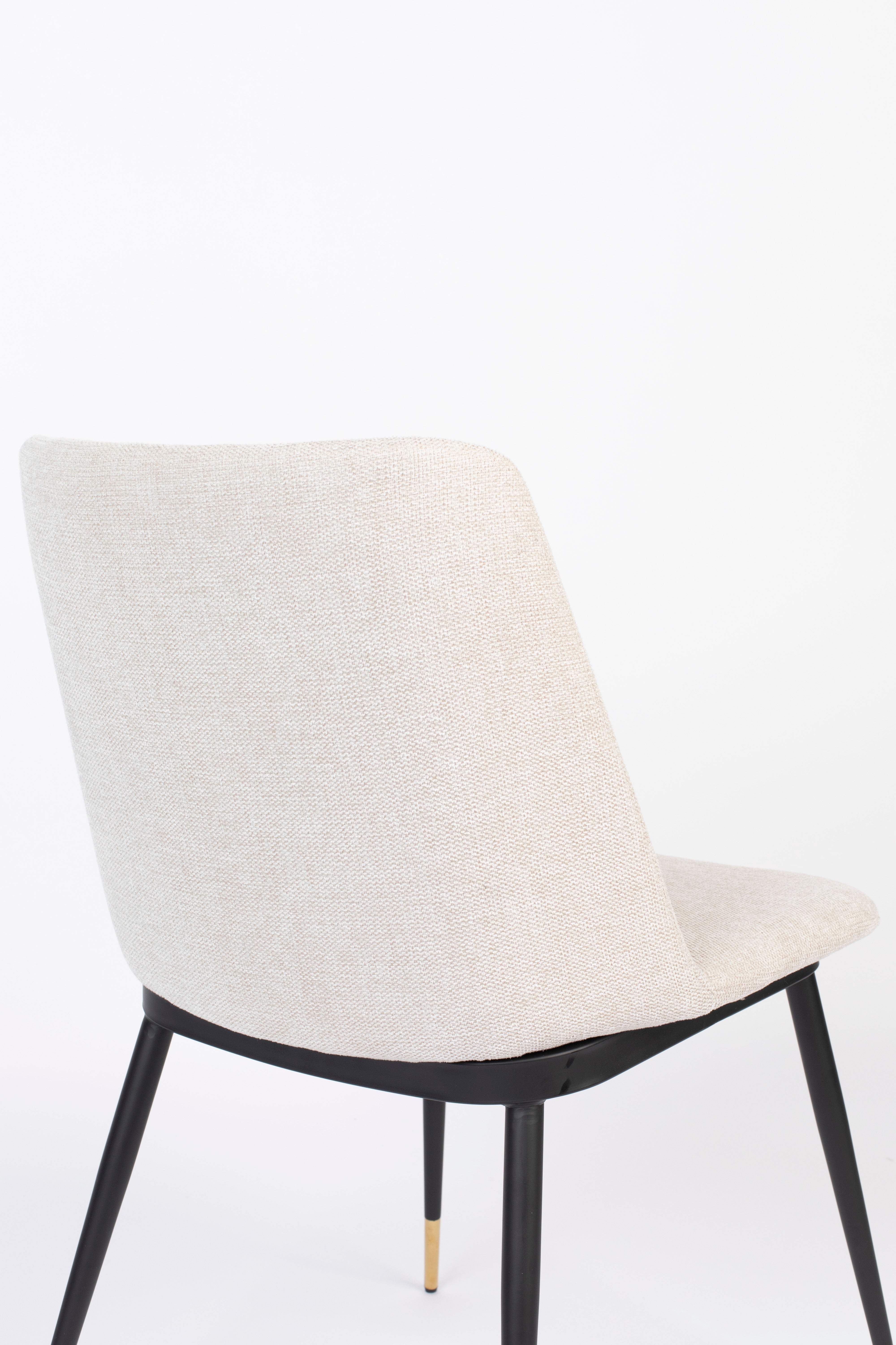 Beige lionel chair with a black base