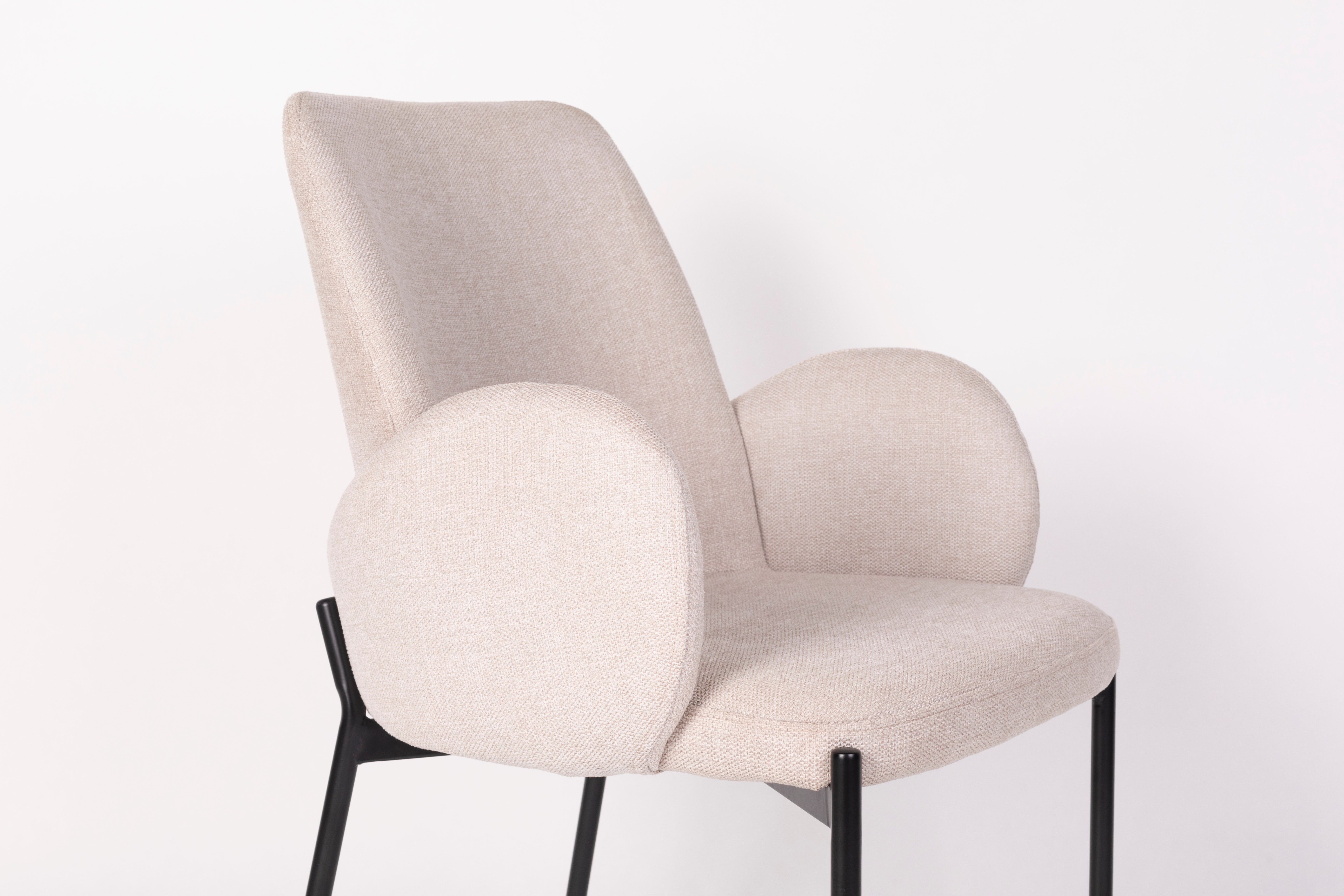 Chair with armrests, i.e. a creamy