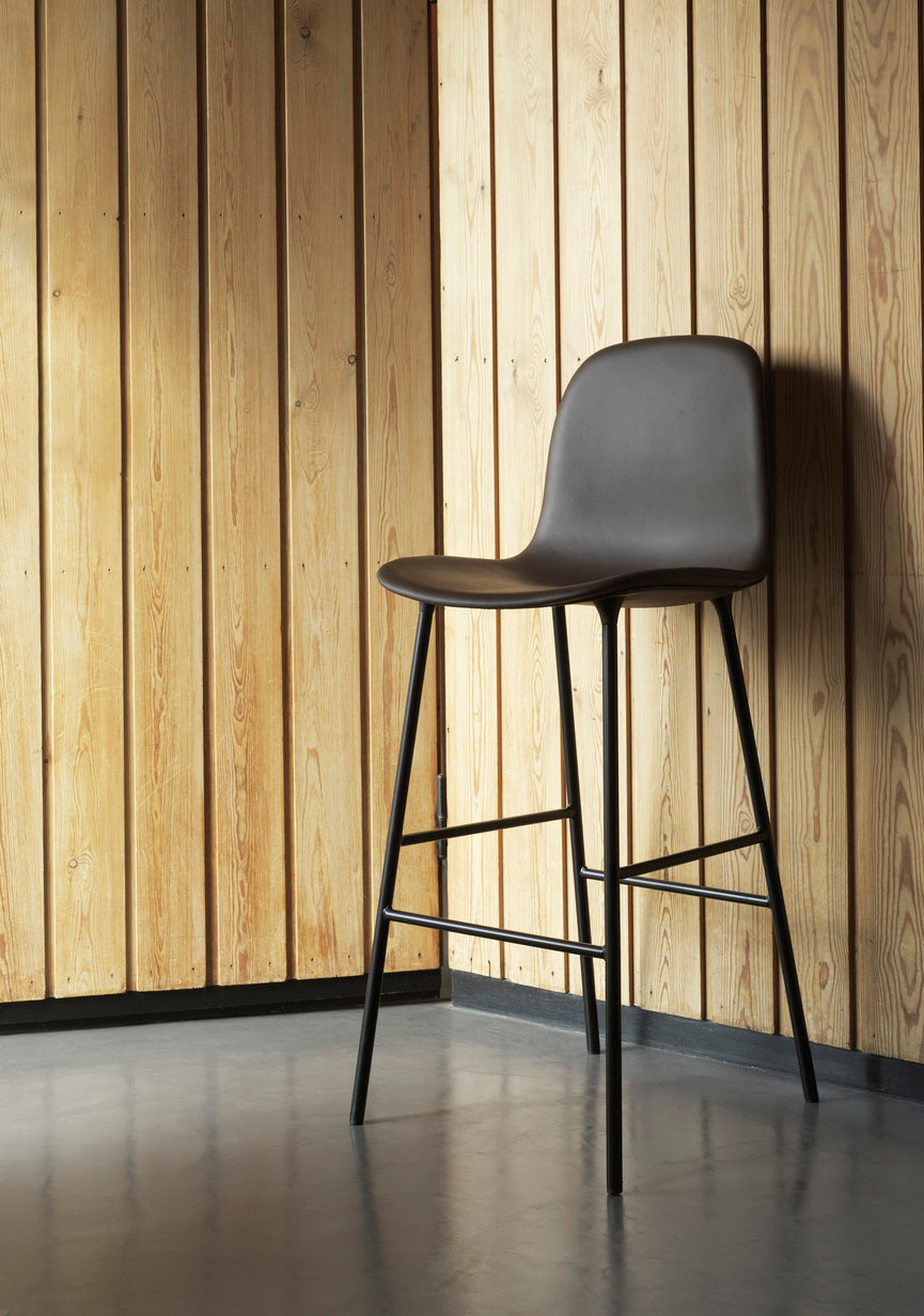 Bar chair upholstered forms with a light gray base
