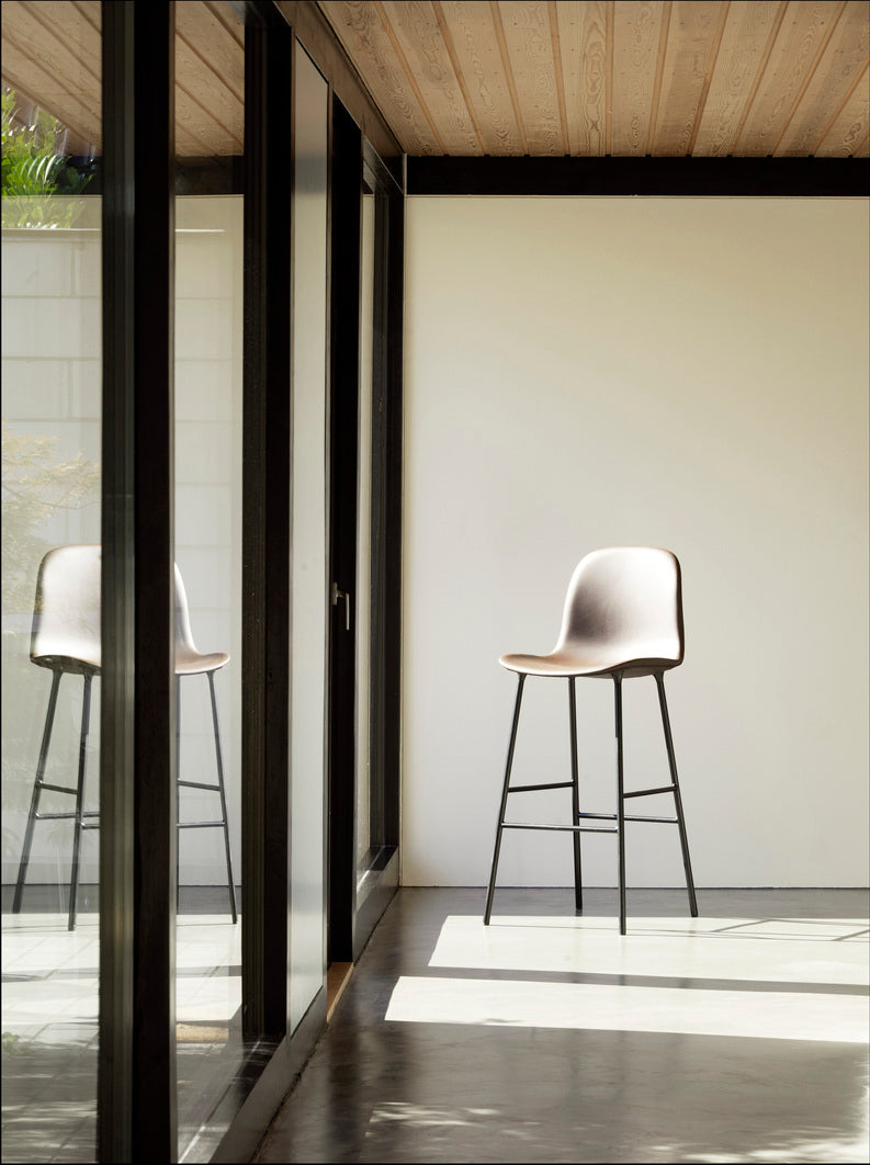 Bar chair upholstered forms with a gray base
