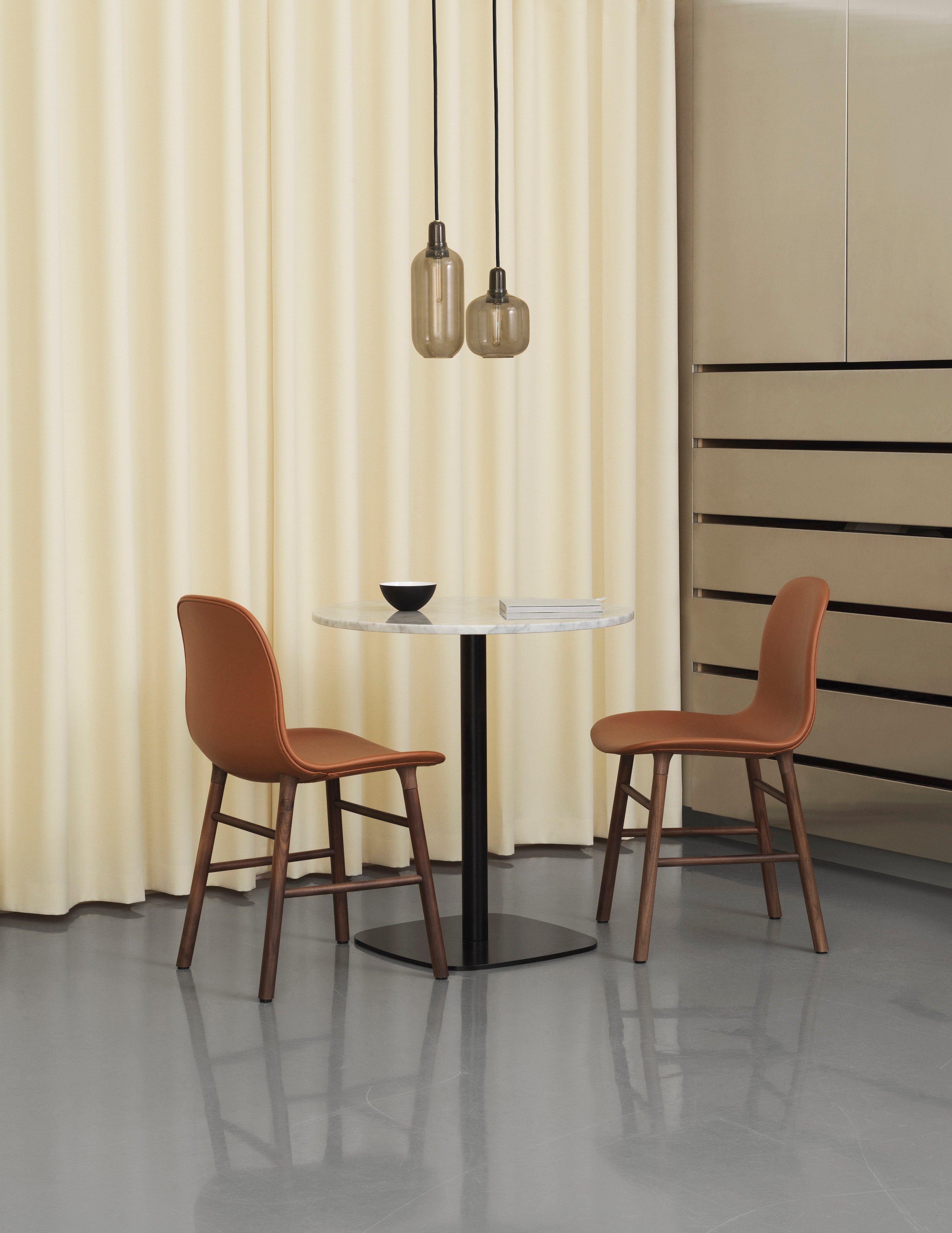Upholstered chair forms with an oak base