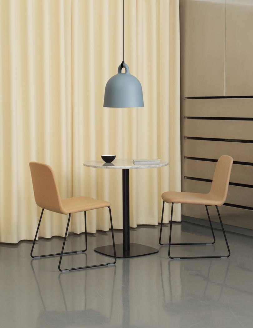 A chair upholstered Just with a black base