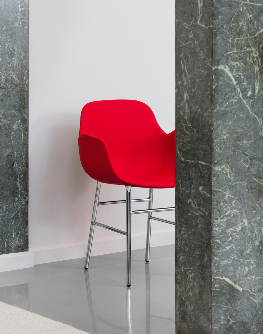 Chair with armrests brown forms with a chrome base