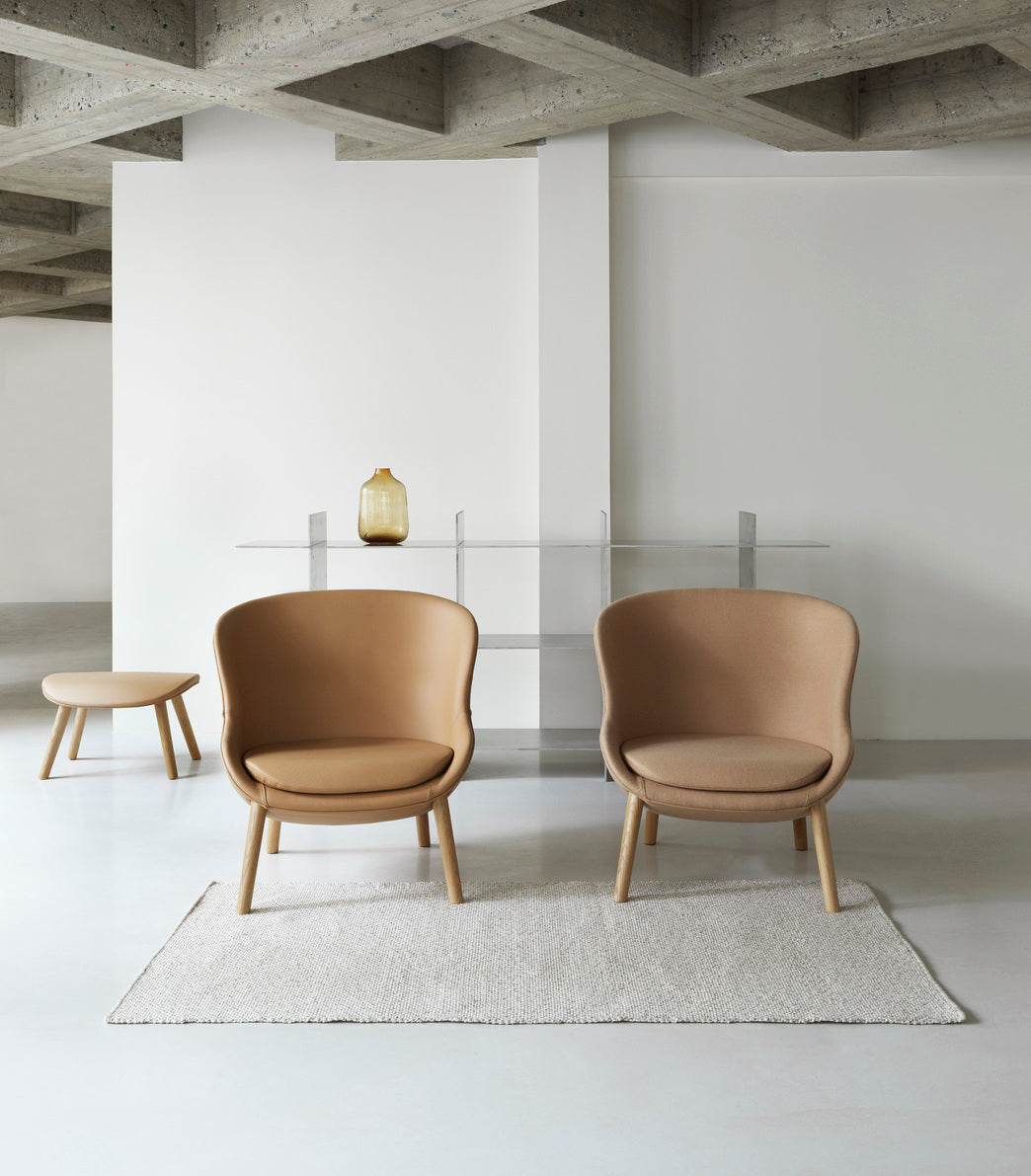 Hyg Upholstered footrest with a black oak base