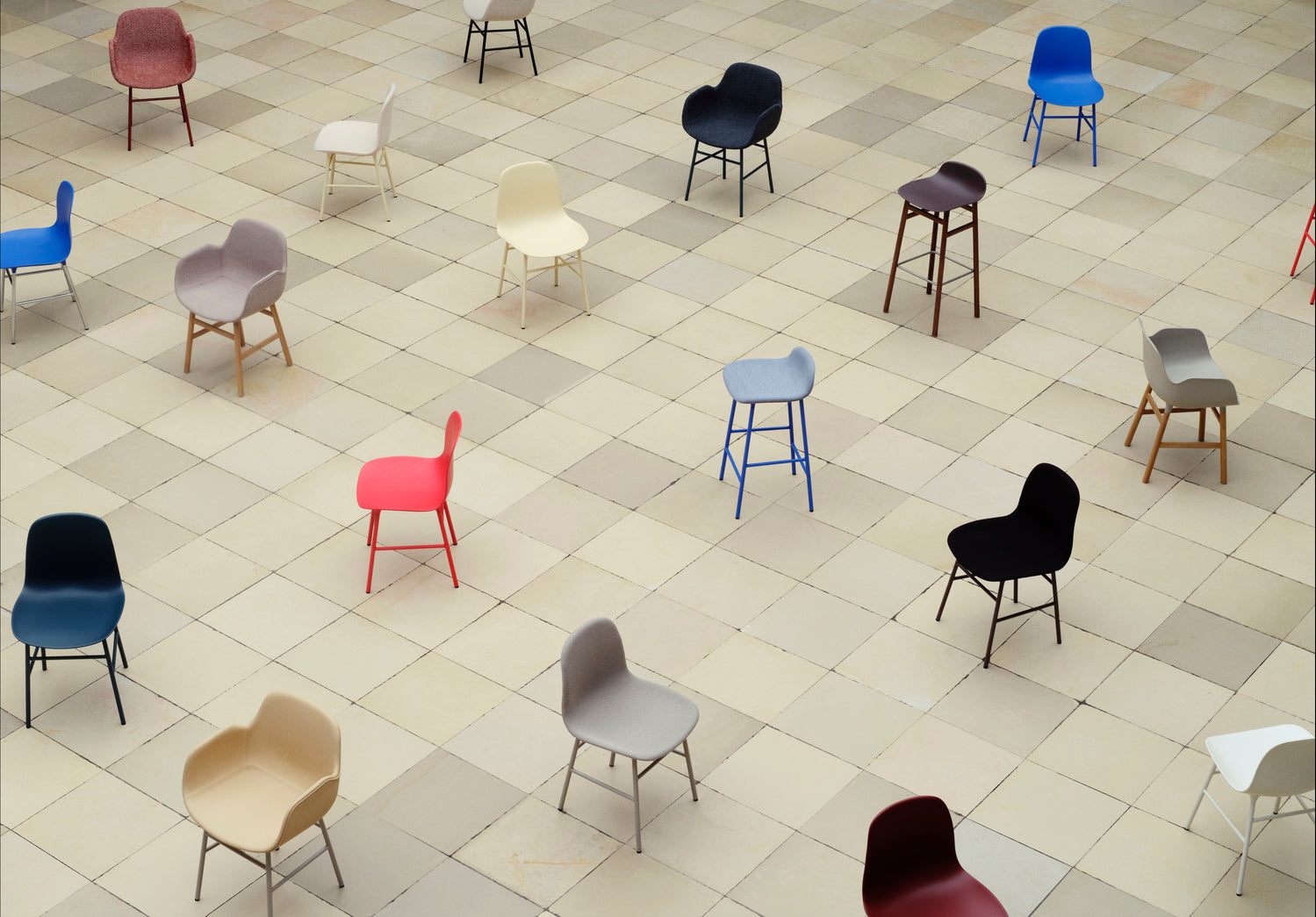 A chair of brown forms with a chrome base