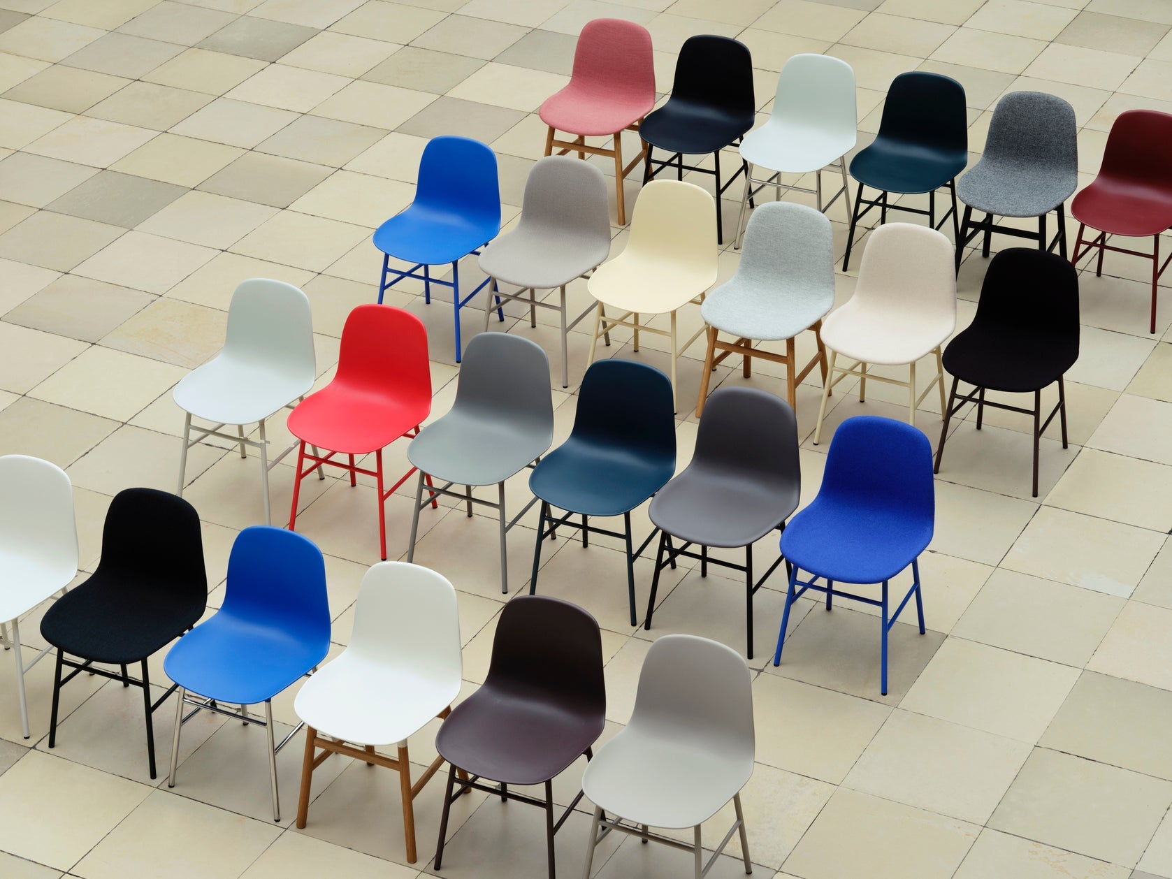 Upholstered chair forms with a red base