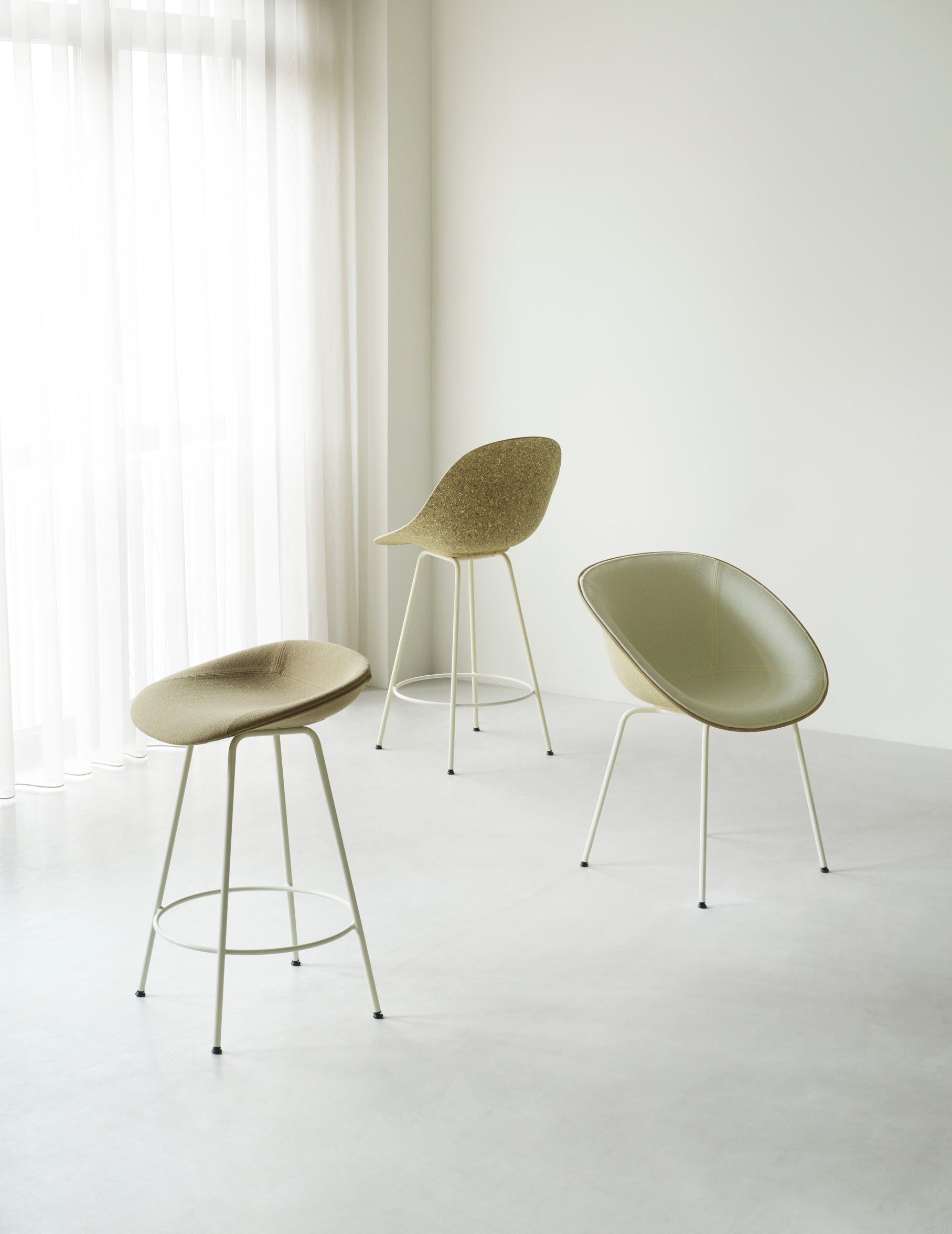 Upholstered beige matrix chair with a black base