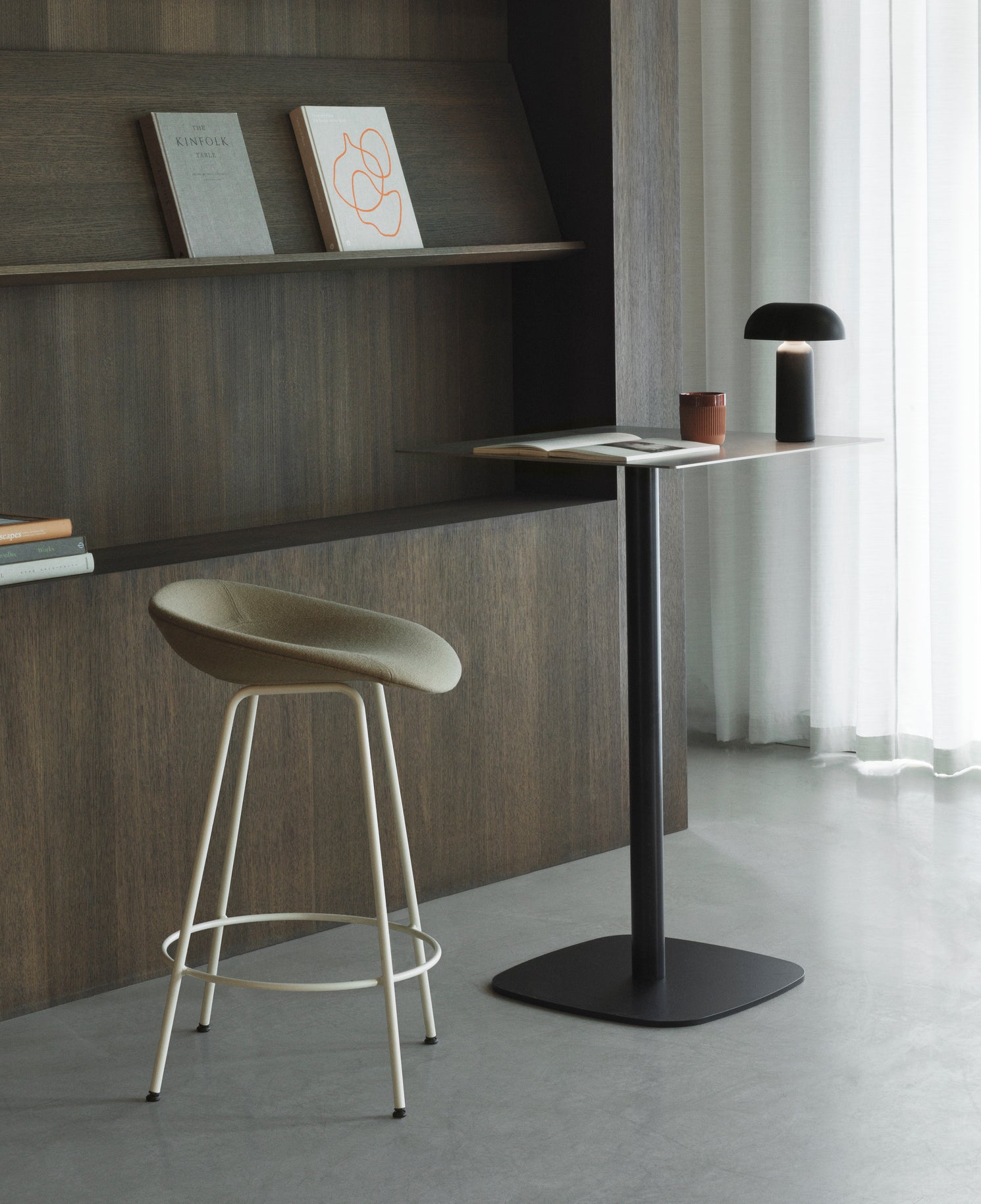 Upholstered beige matrix chair with a black base