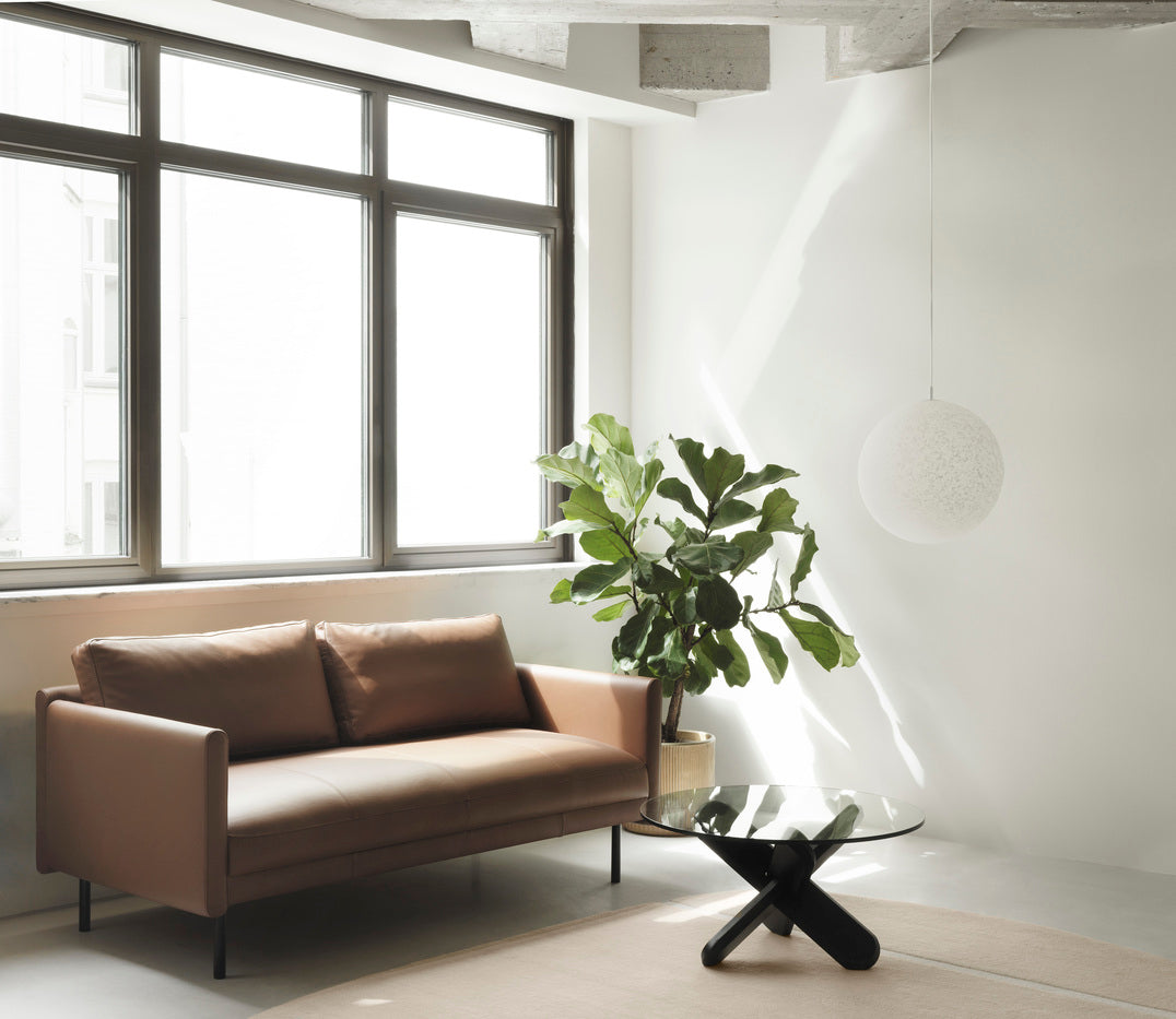 Brown rar sofa with a black base