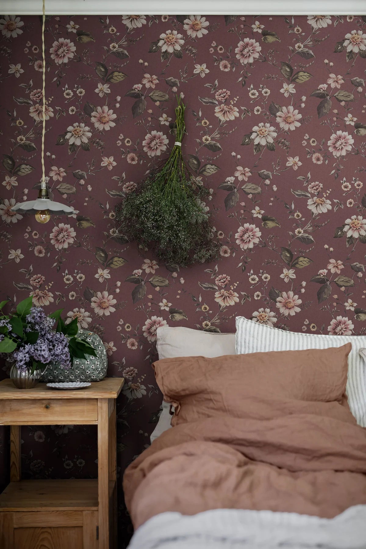 Structural mural with a floral pattern of MARION’S in burgundy with white