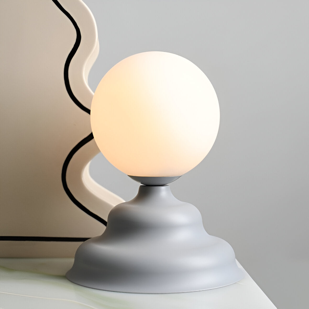Table lamp with a glass lampshade gray wave
