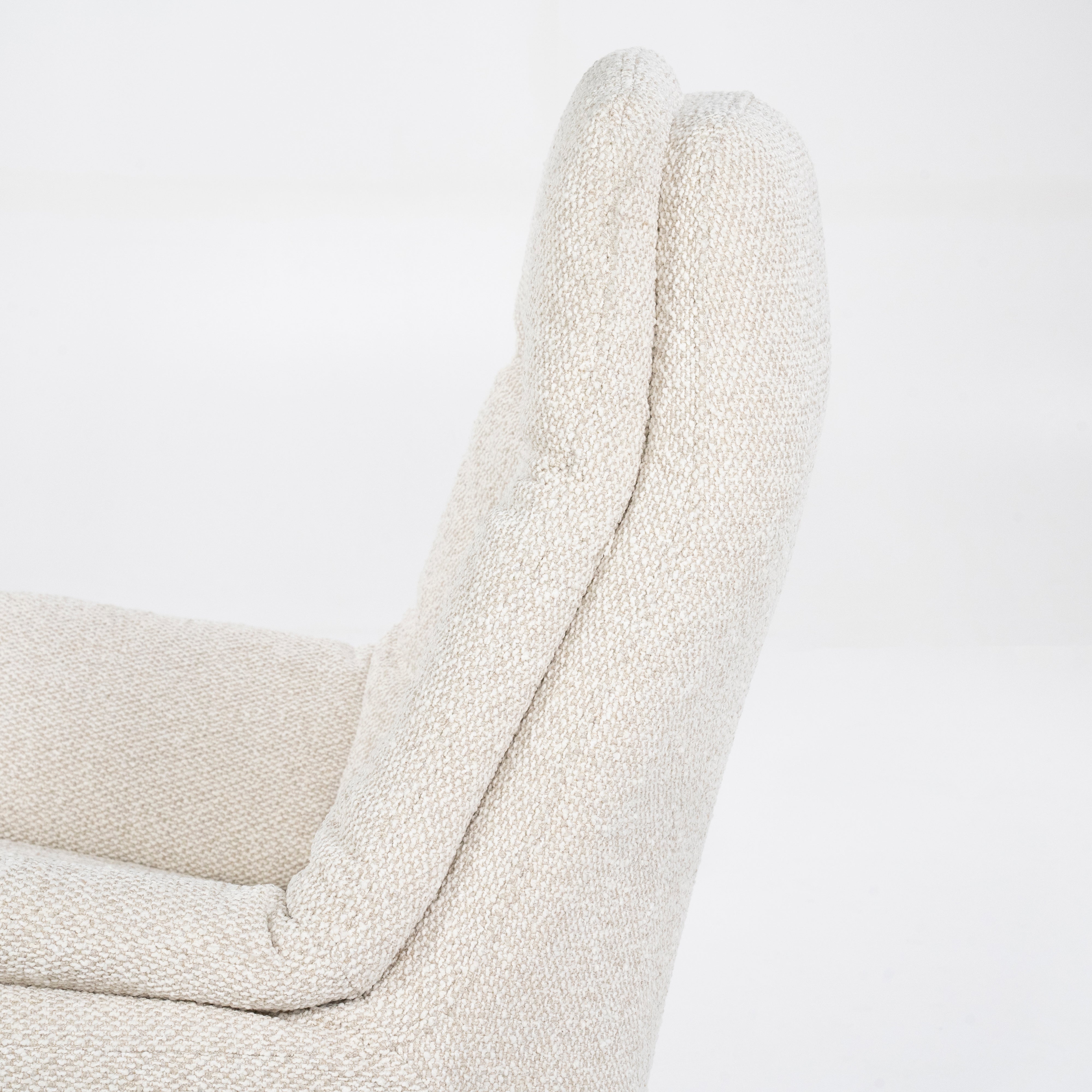 CALEB beige armchair with black base and footrest