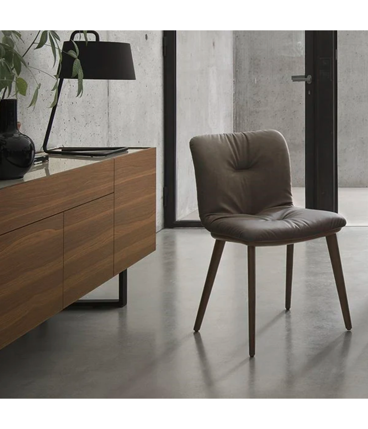 ANNIE SOFT upholstered chair with a dark wooden base