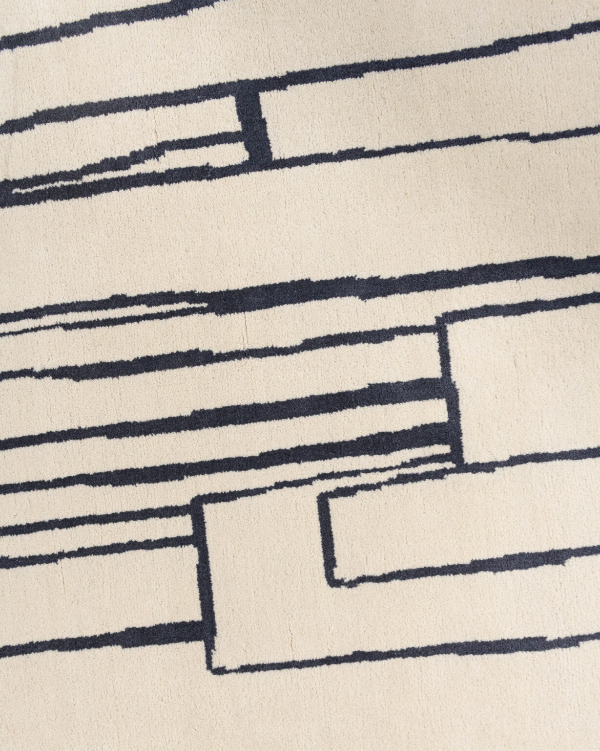 Dywan dekoracyjny asymetryczny CONTOUR szarobeżowy z czarnym