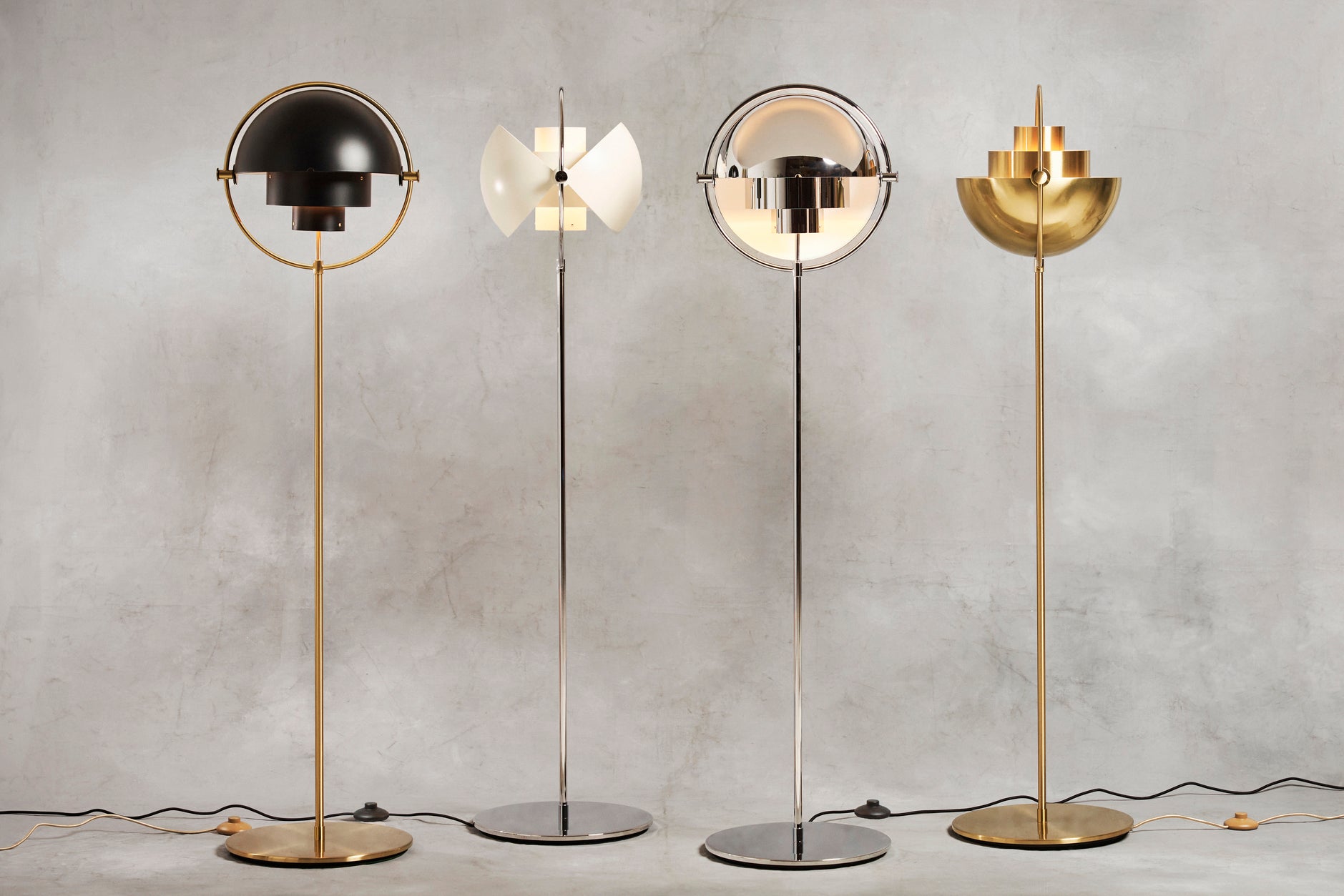 MULTI-LITE floor lamp in black with a brass base