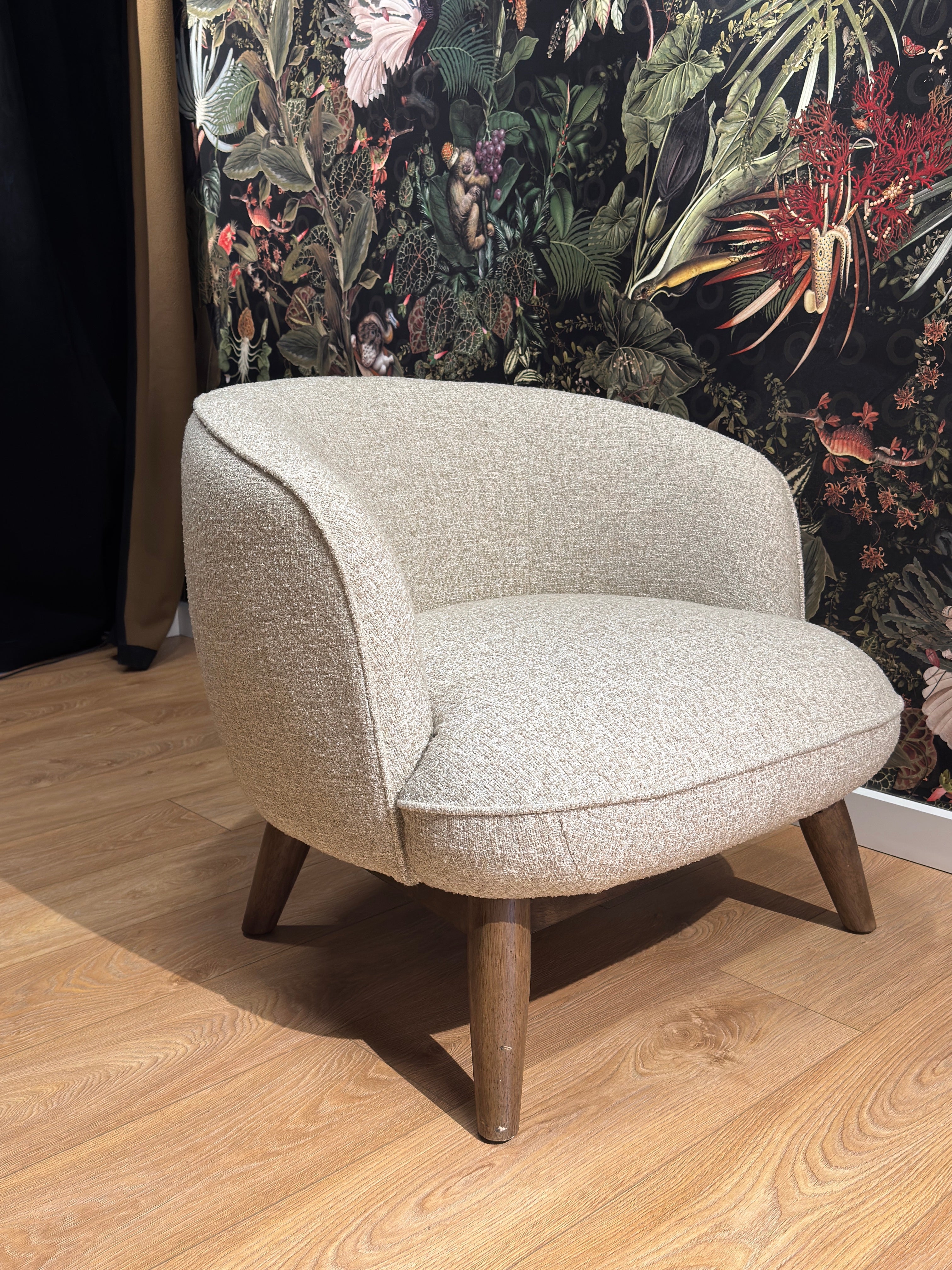 Upholstered armchair BENTON in gray-beige with a wooden base - display model