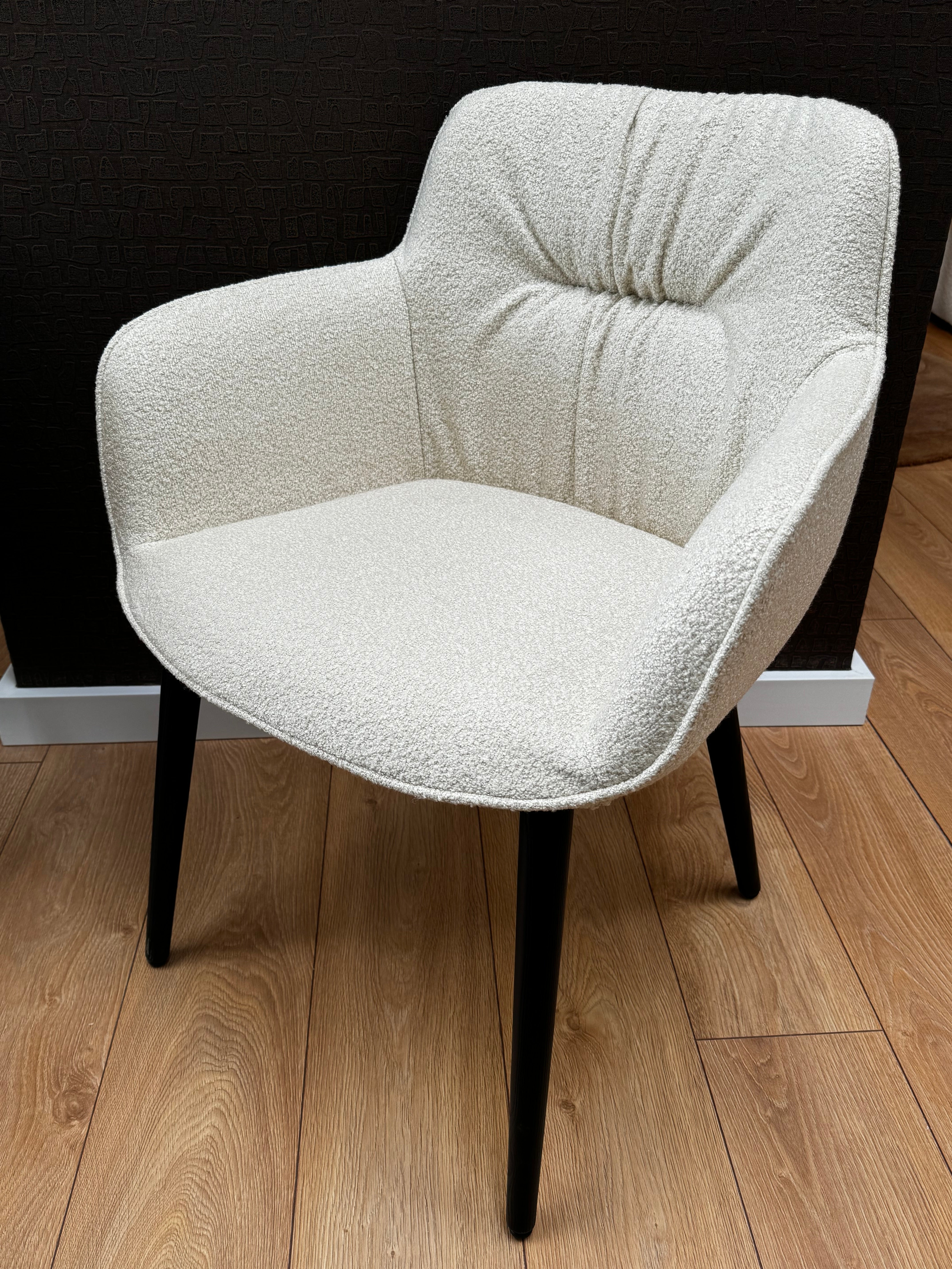 Cocoon cream chair with a black base