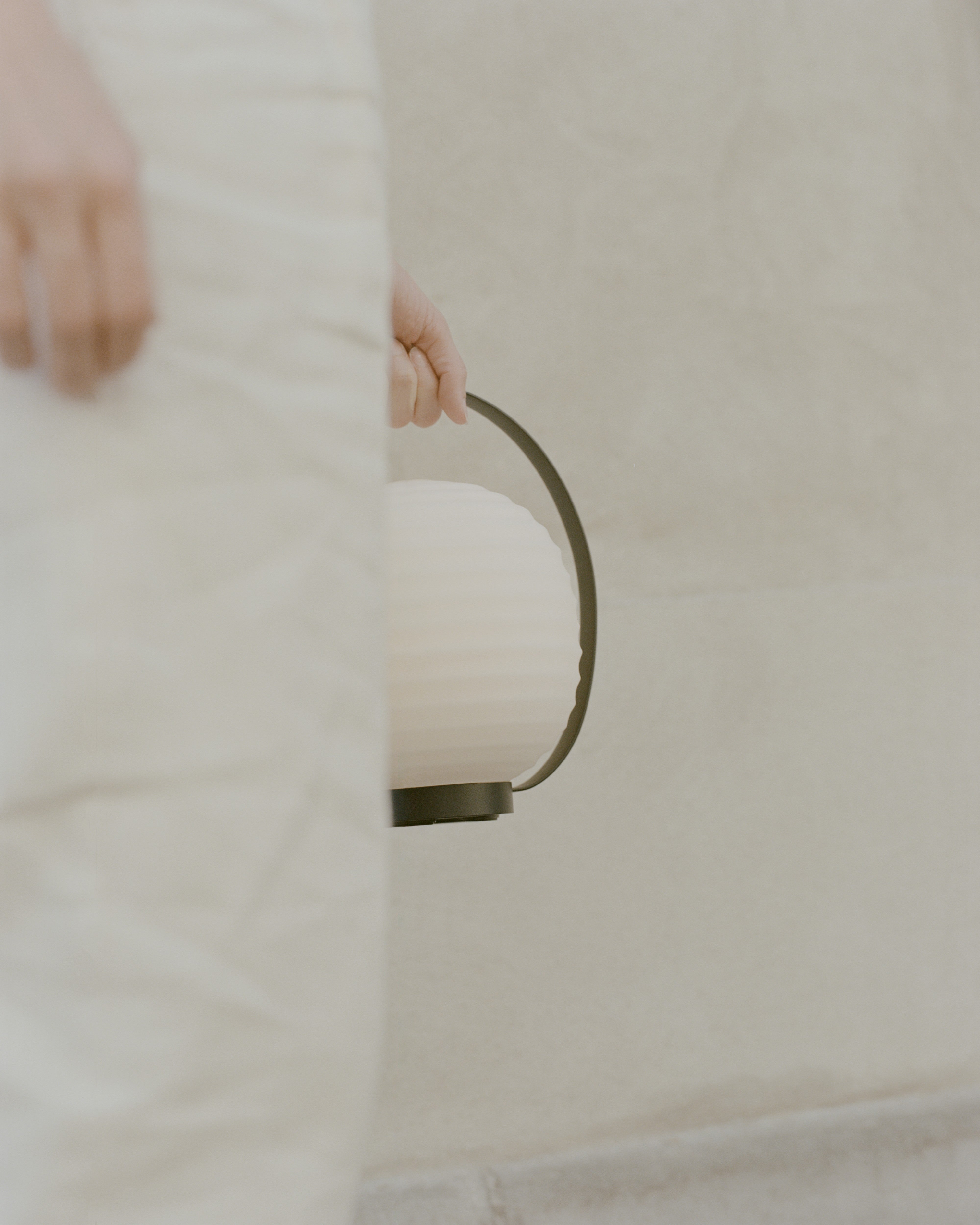 Lantern white portable lamp with a black handle