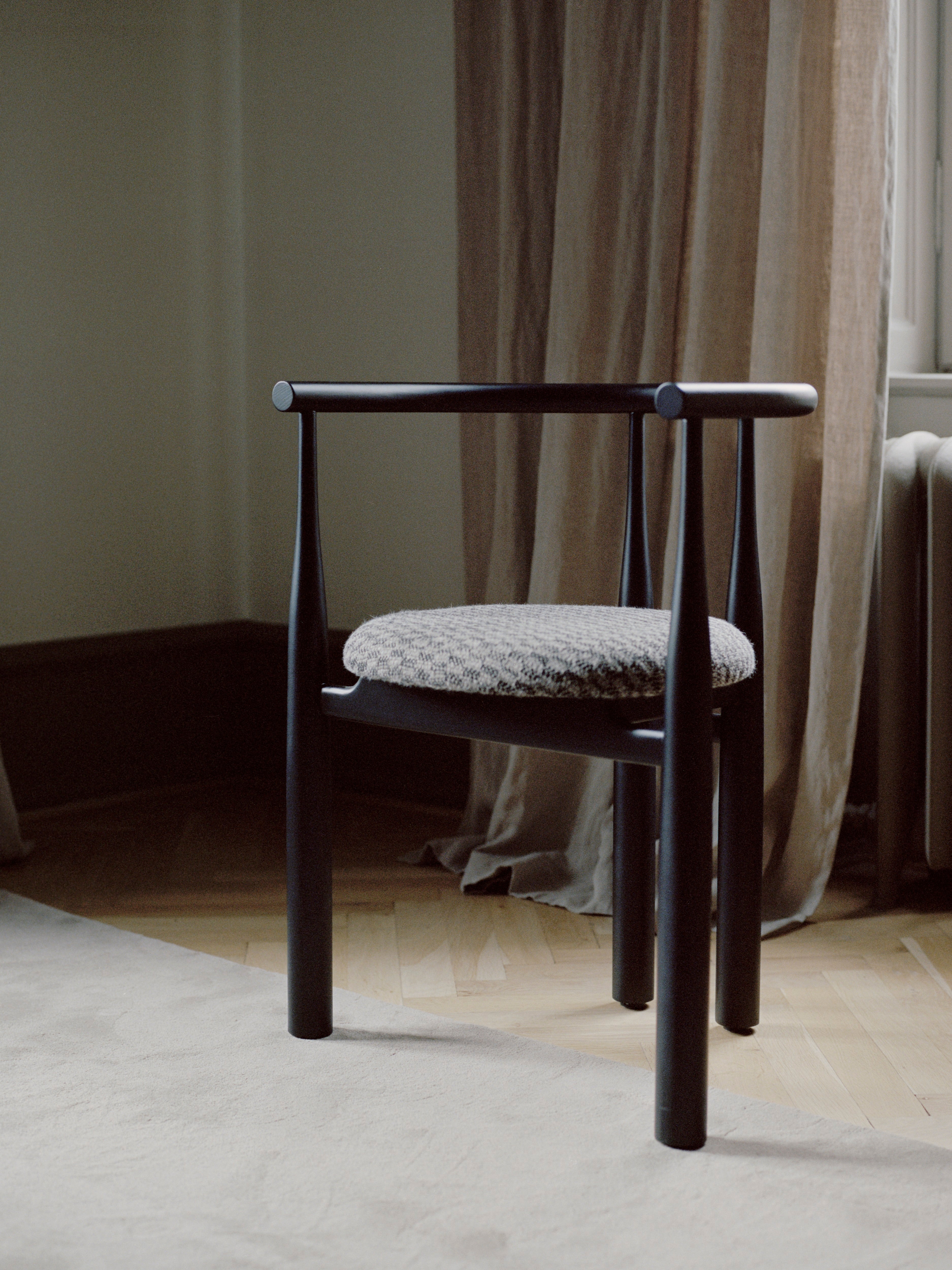 Bukowski chair upholstered with a black beech base